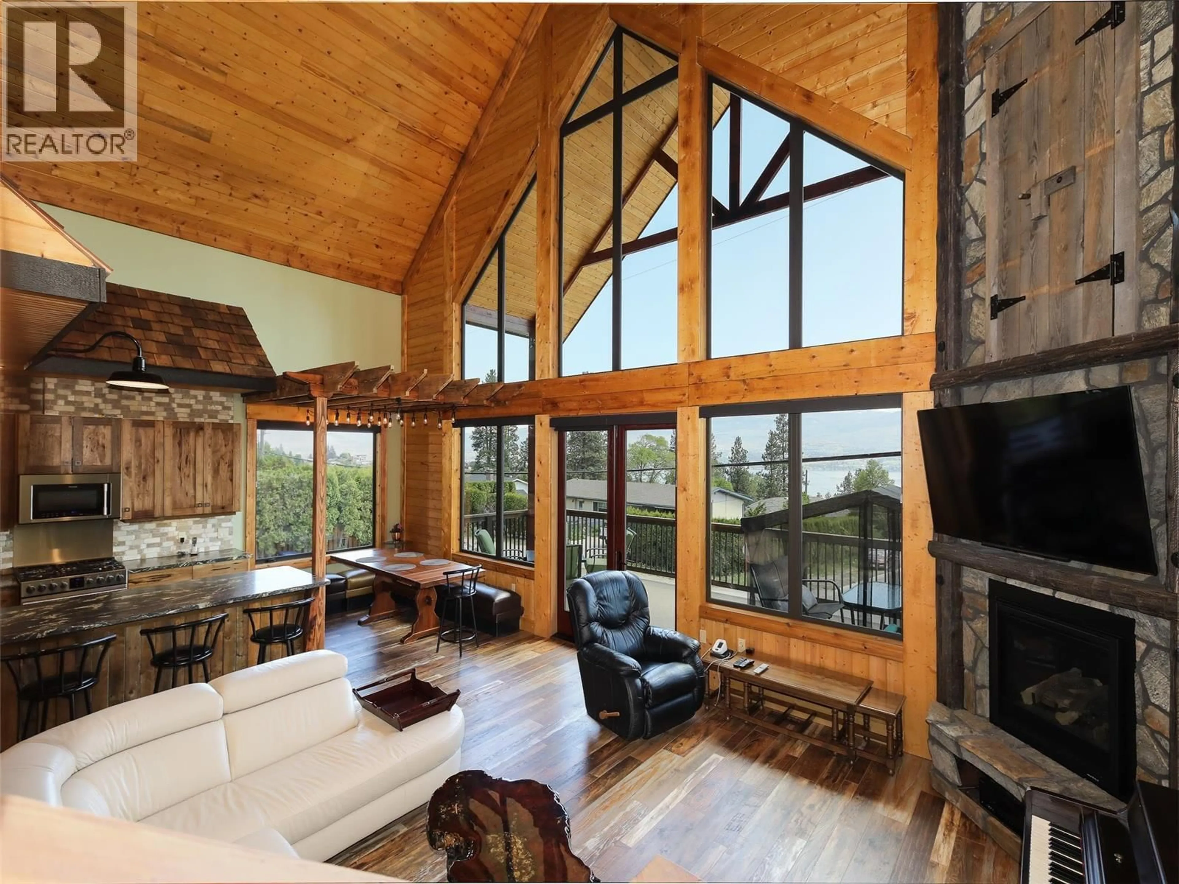 Living room with furniture, wood/laminate floor for 3032 OURTOLAND ROAD, West Kelowna British Columbia V1Z2H8