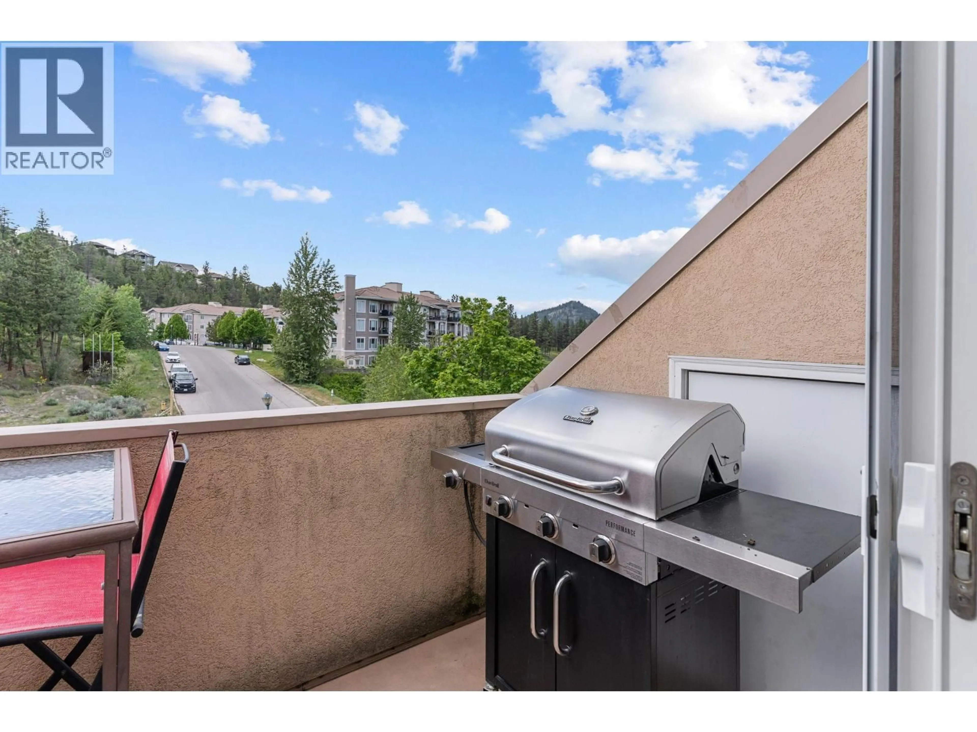 Patio, city buildings view from balcony for 318 - 3185 VIA CENTRALE OTHER, Kelowna British Columbia V1V2A7