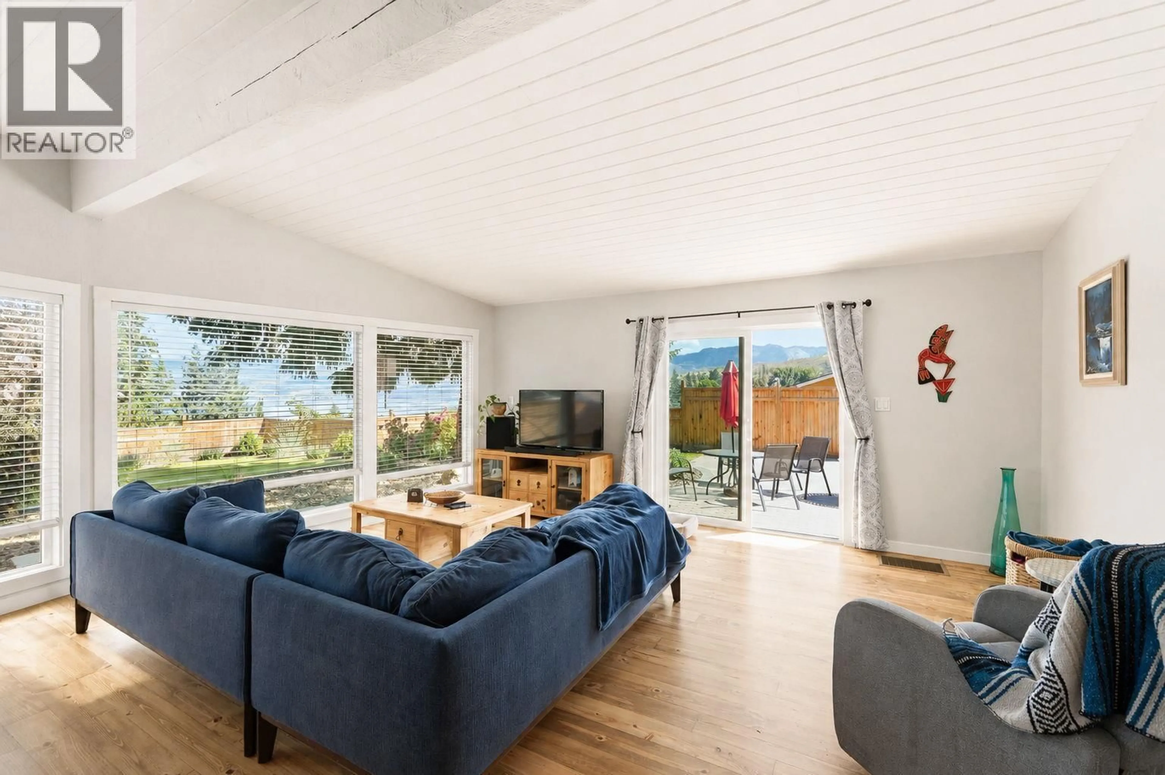Living room with furniture, wood/laminate floor for 2853 LOWER GLENROSA ROAD, West Kelowna British Columbia V4T1V7