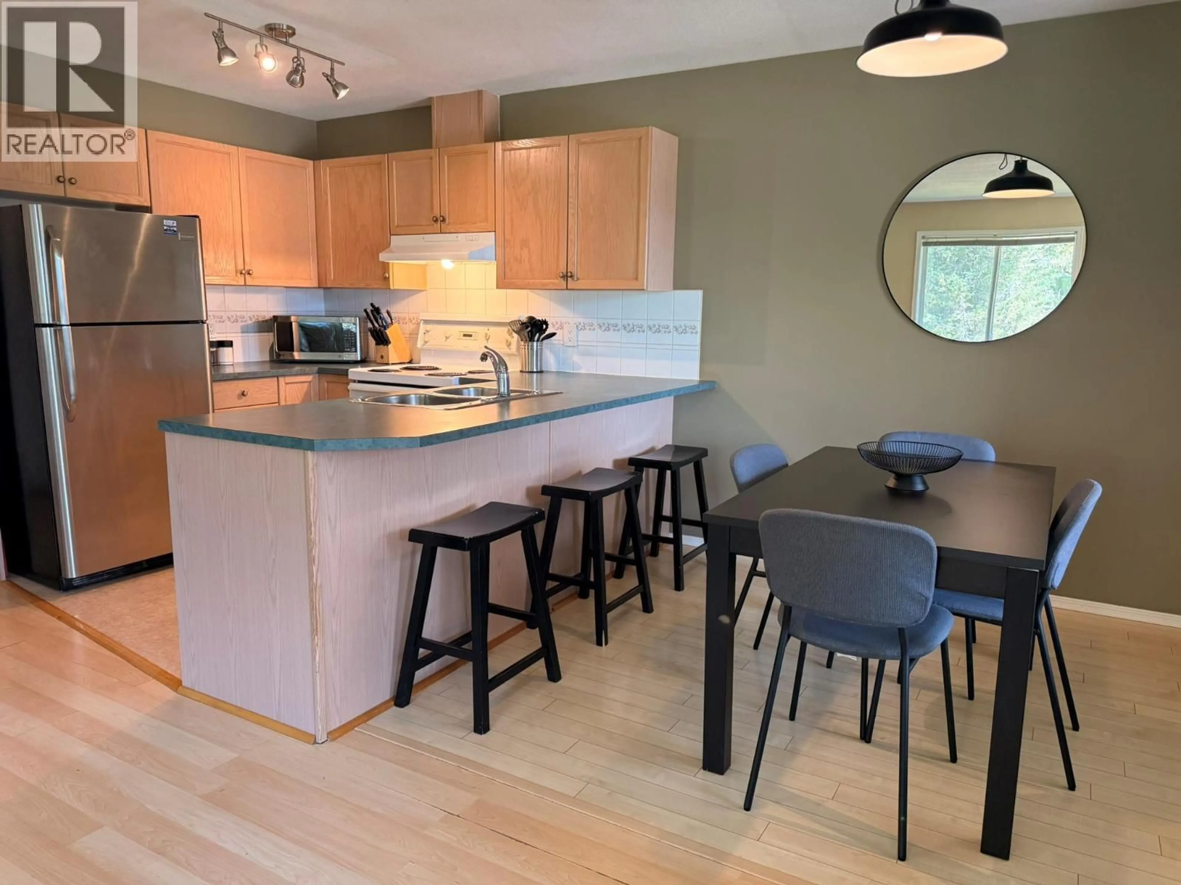 Open concept kitchen, wood/laminate floor for 28A WOLF CRESCENT, Invermere British Columbia V0A1K2