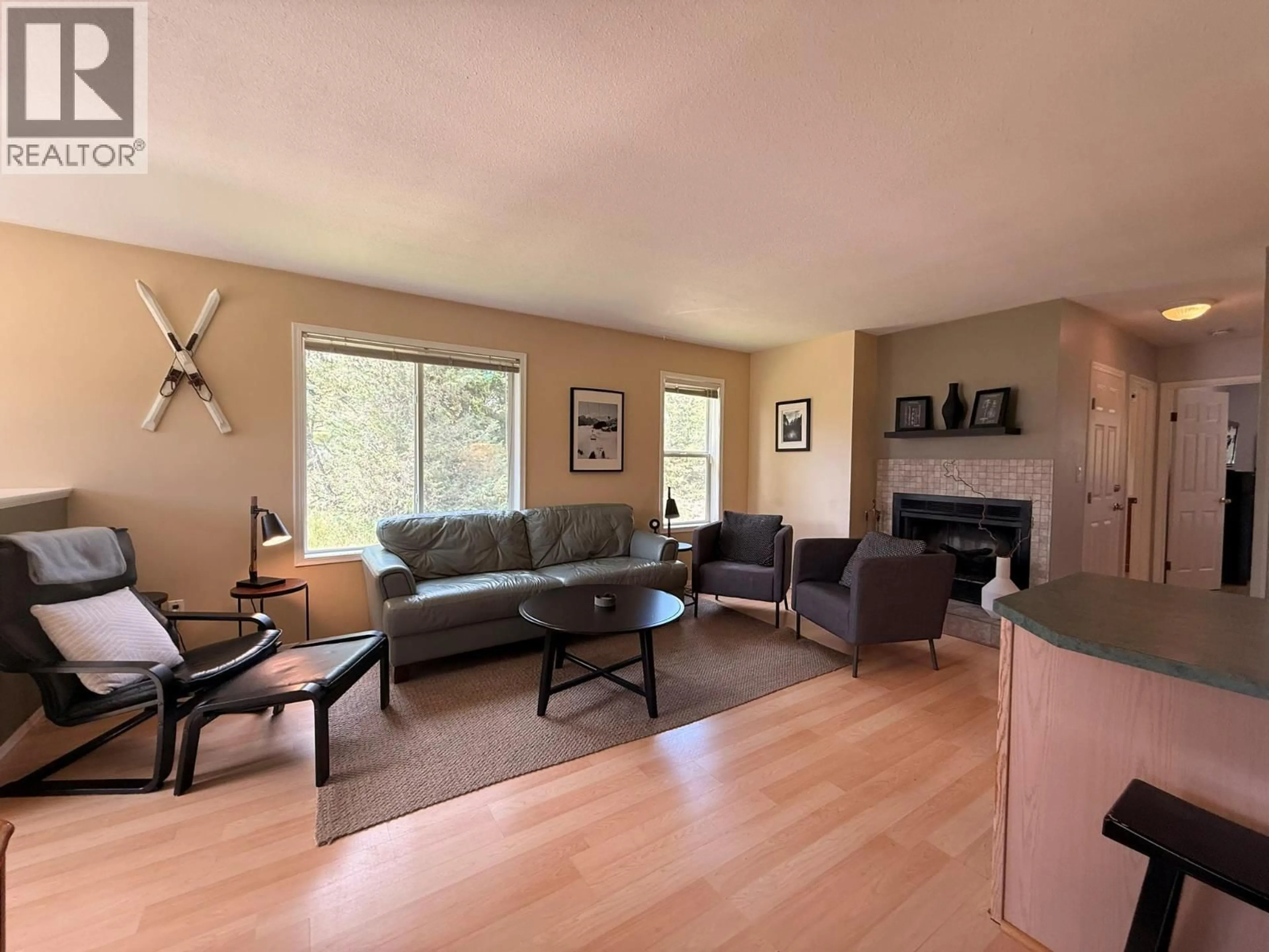 Living room with furniture, wood/laminate floor for 28A WOLF CRESCENT, Invermere British Columbia V0A1K2
