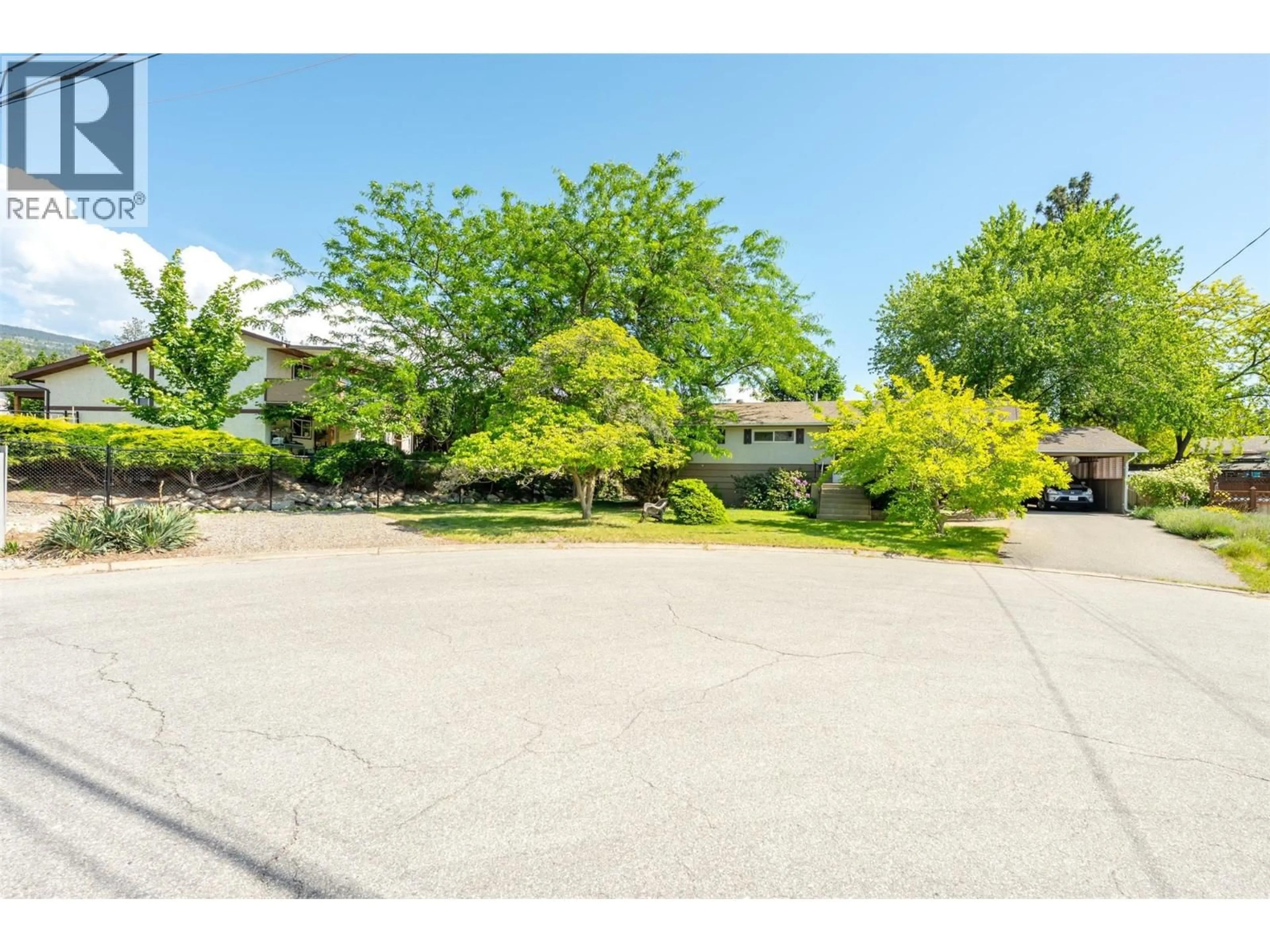 A pic from outside/outdoor area/front of a property/back of a property/a pic from drone, street for 148 WOODLANDS PLACE, Penticton British Columbia V2A3B3