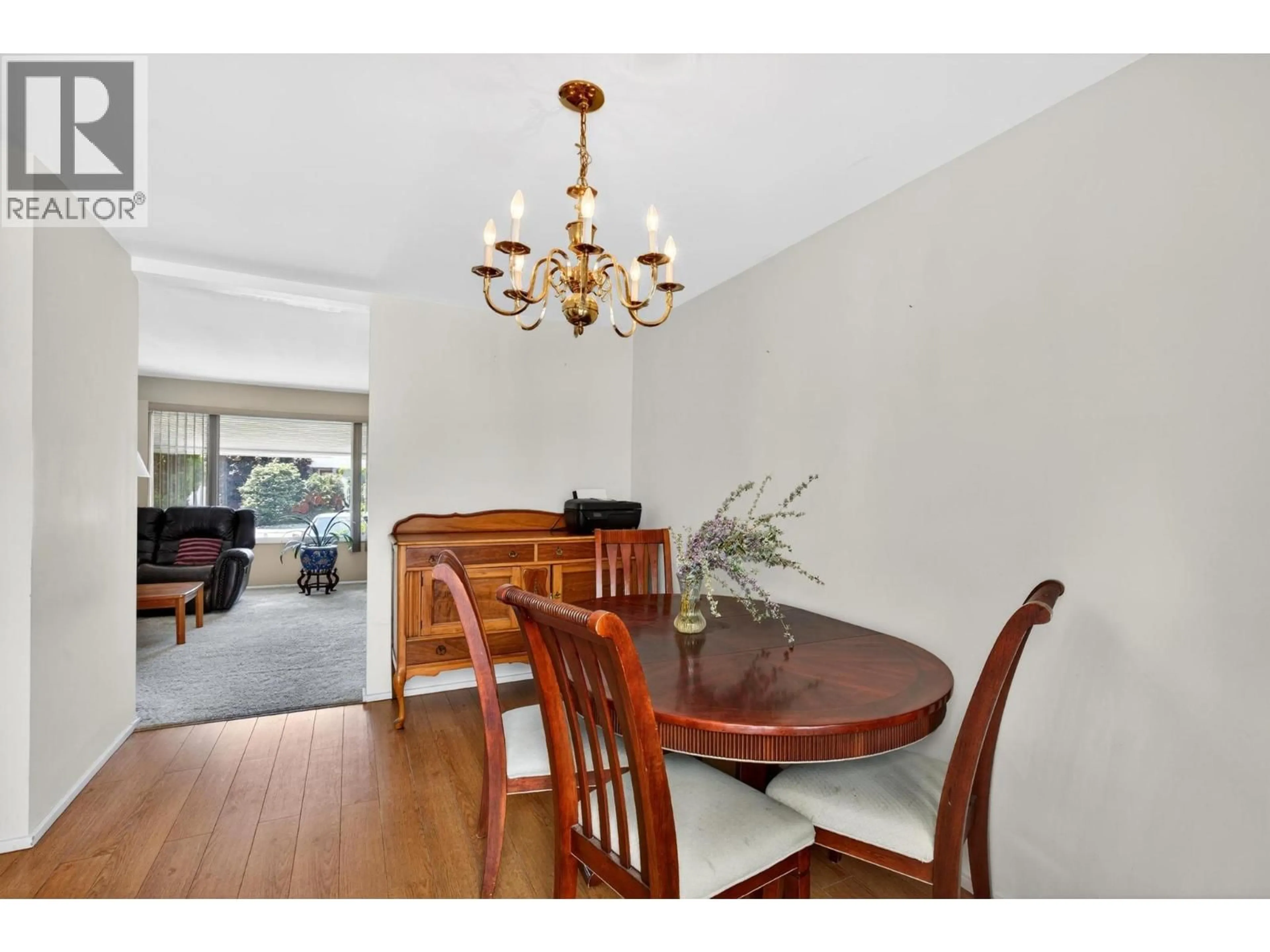 Dining room, wood/laminate floor for 1820 QUEBEC STREET, Penticton British Columbia V2A6E1
