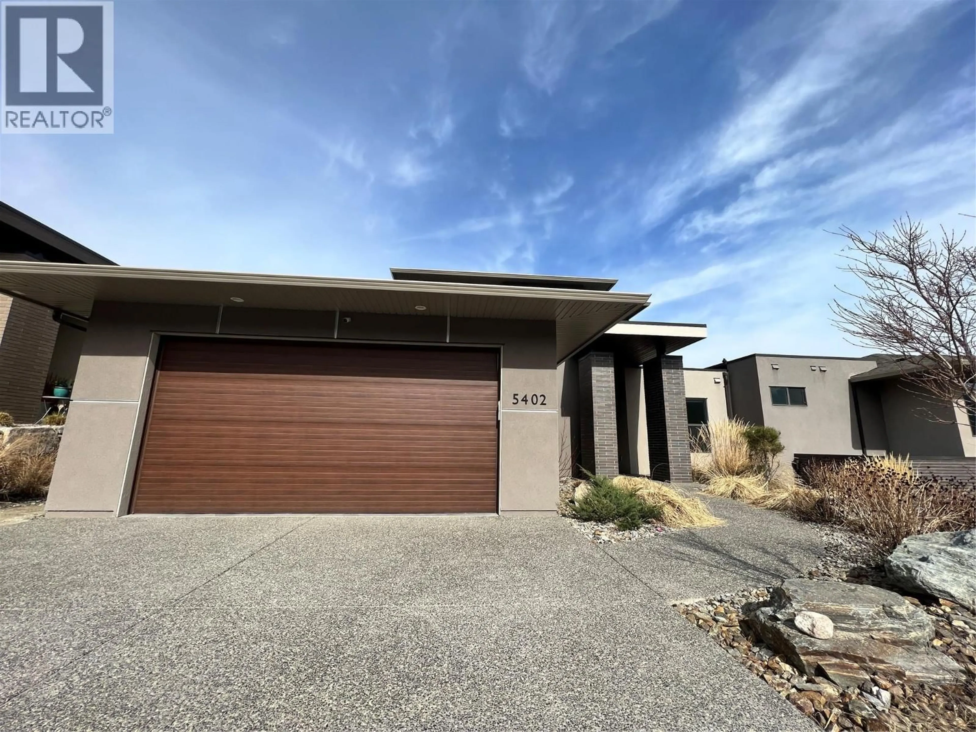 Home with brick exterior material, street for 5402 KESTREL LANE, Kelowna British Columbia V1W0A6
