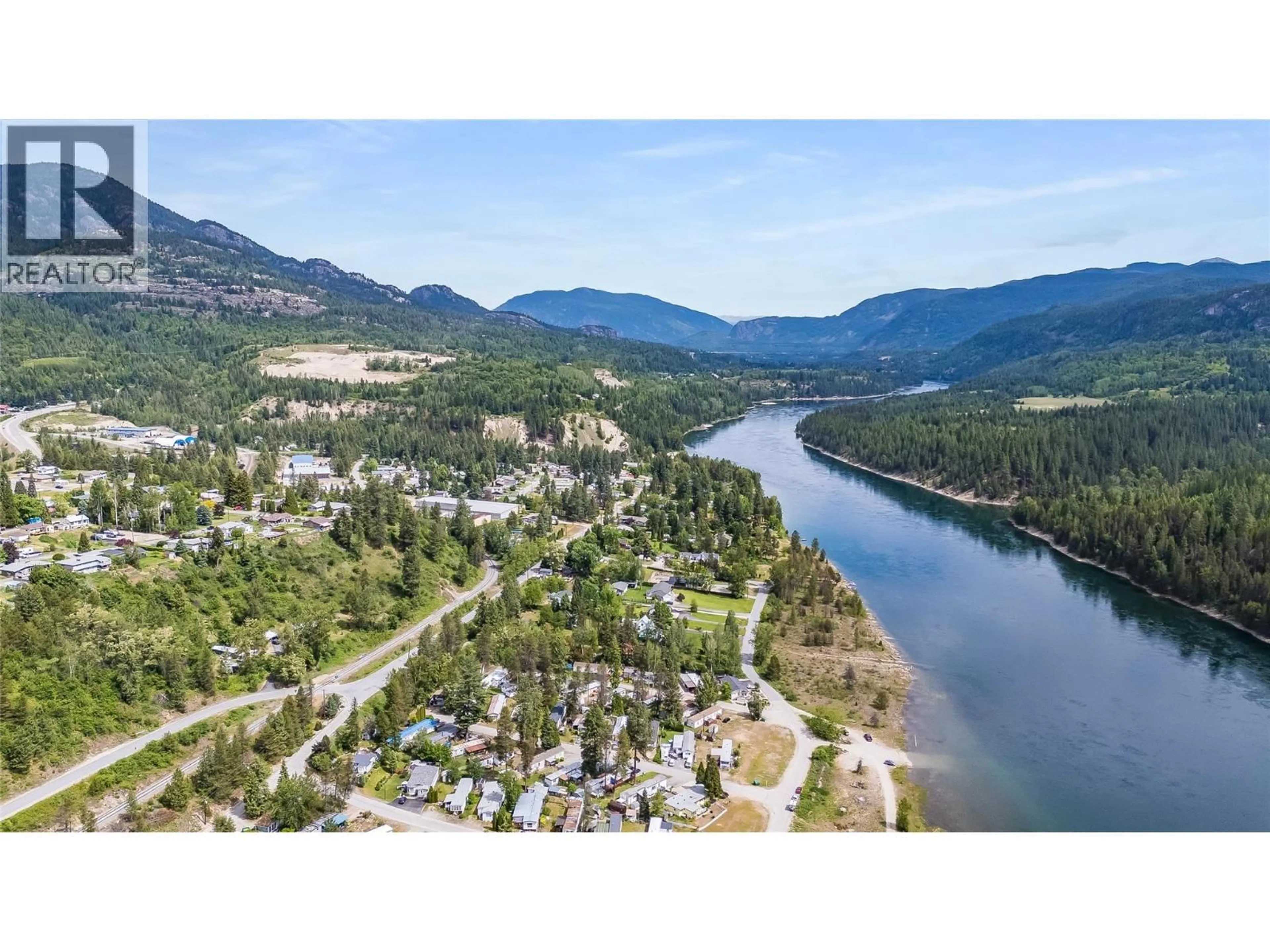 A pic from outside/outdoor area/front of a property/back of a property/a pic from drone, water/lake/river/ocean view for 54 - 500 16TH AVENUE, Genelle British Columbia V0G1G0