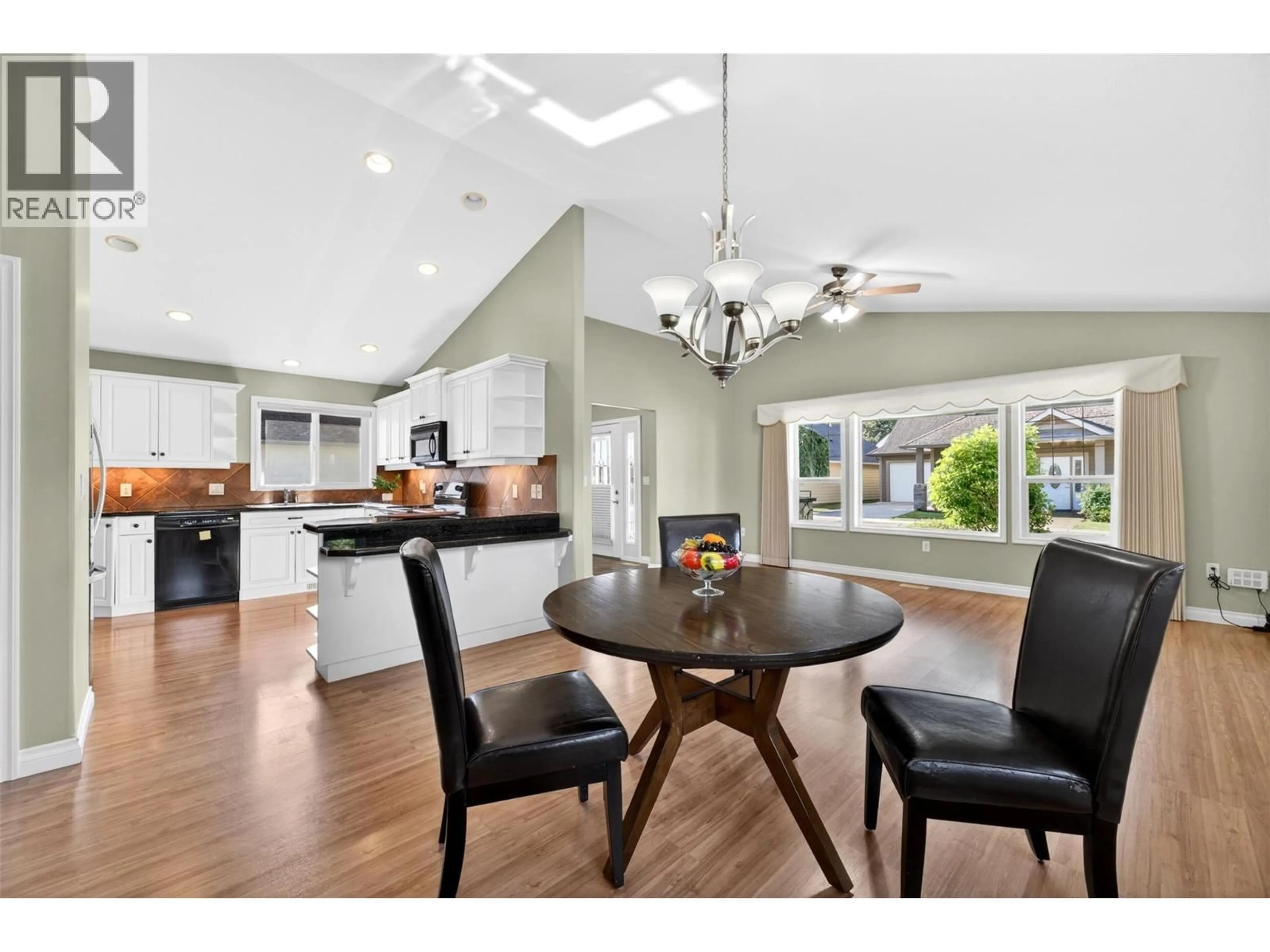 Open concept kitchen, wood/laminate floor for 5 - 1231 10 STREET SOUTHWEST, Salmon Arm British Columbia V1E0A5