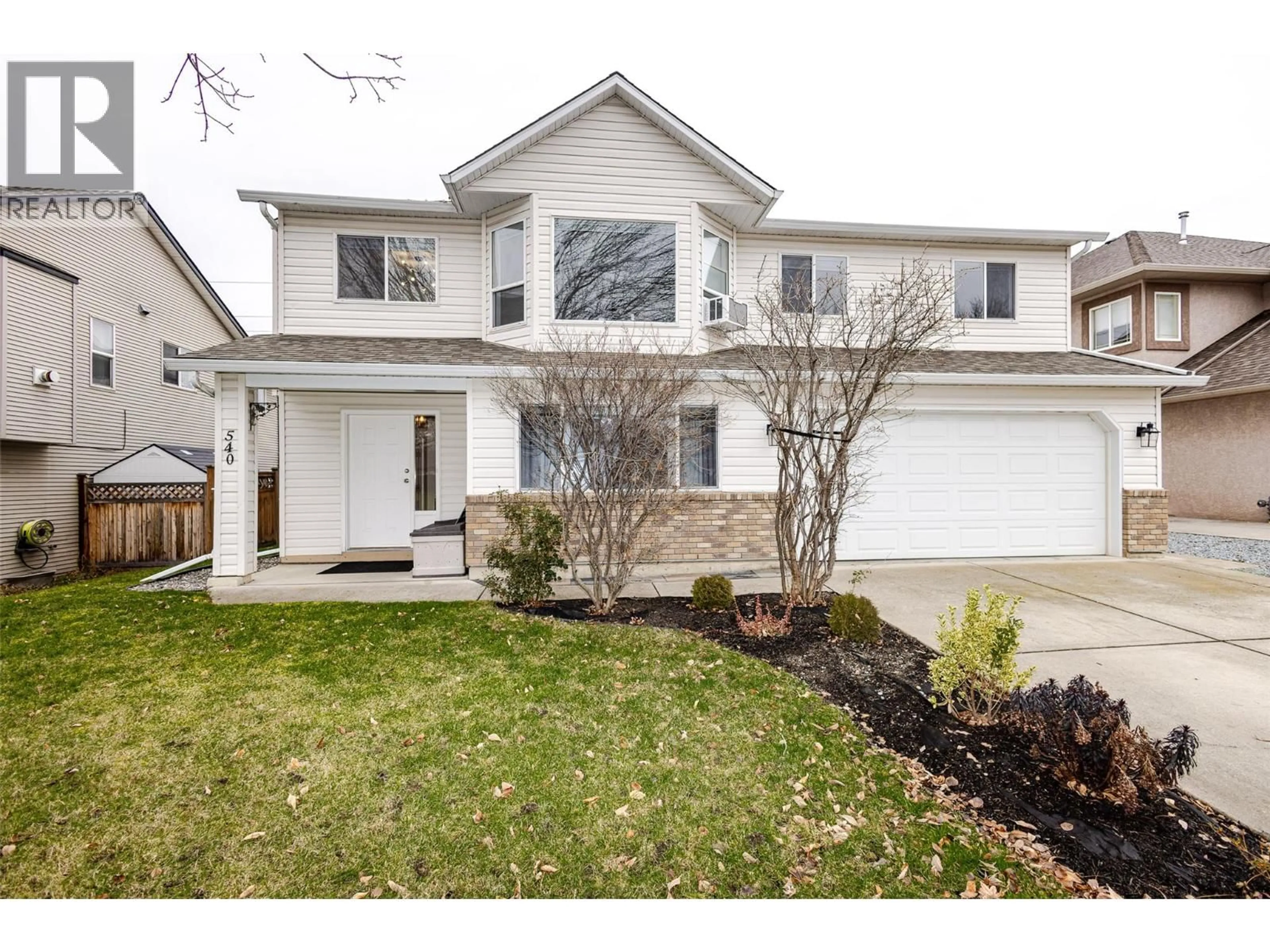 Home with vinyl exterior material, street for 540 KLASSEN ROAD, Kelowna British Columbia V1X7P3