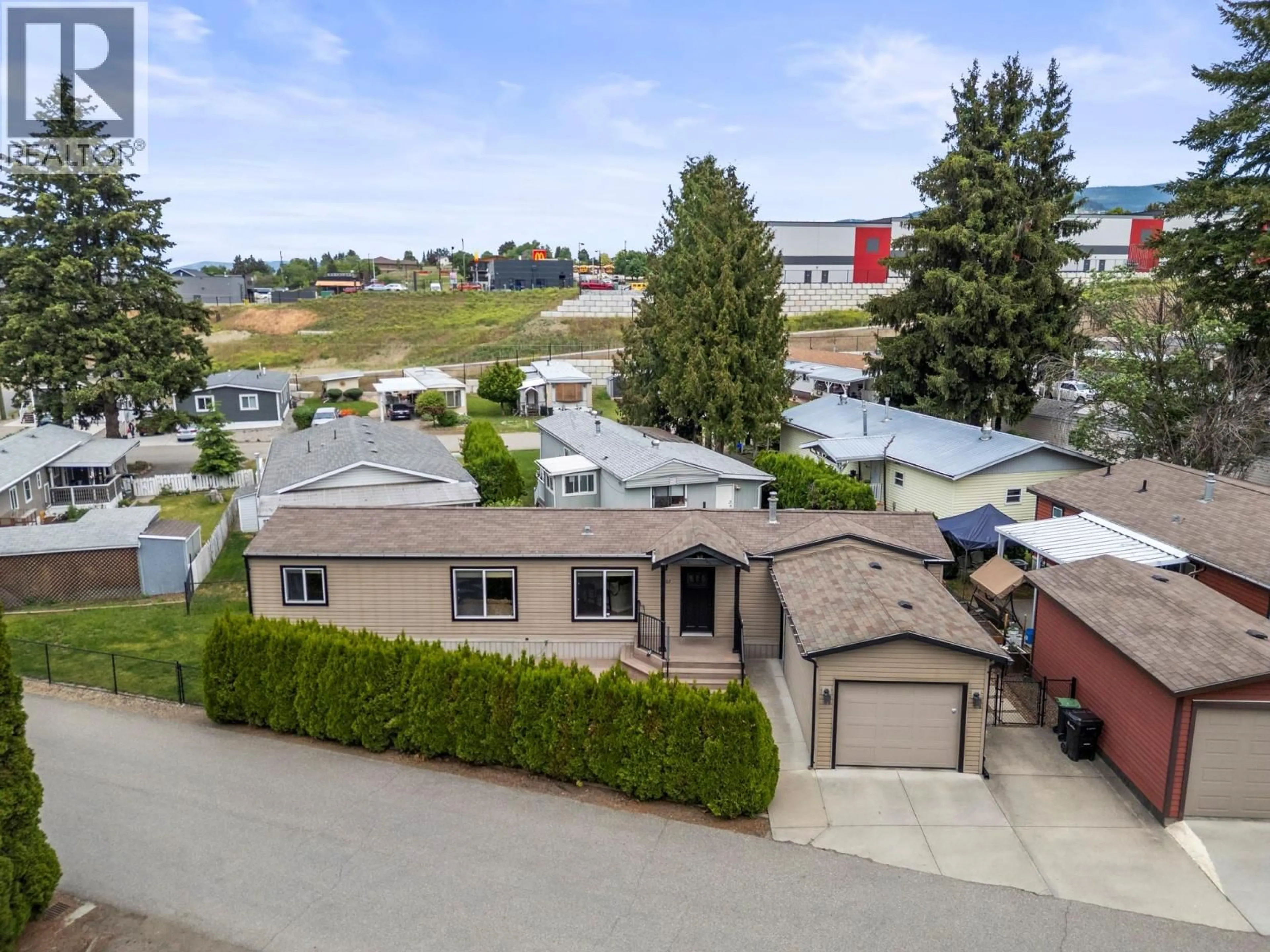 A pic from outside/outdoor area/front of a property/back of a property/a pic from drone, street for 507 - 4701 PLEASANT VALLEY ROAD, Vernon British Columbia V1T4M7