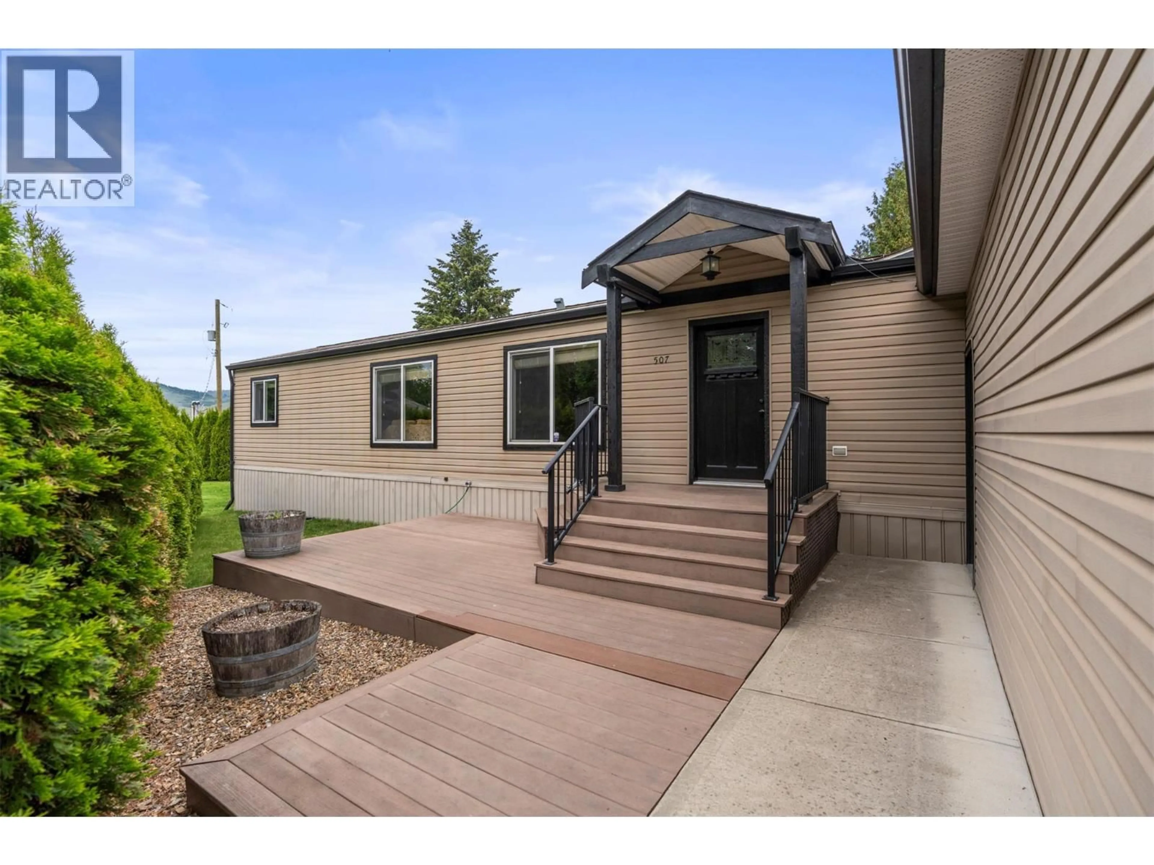 Home with vinyl exterior material, street for 507 - 4701 PLEASANT VALLEY ROAD, Vernon British Columbia V1T4M7