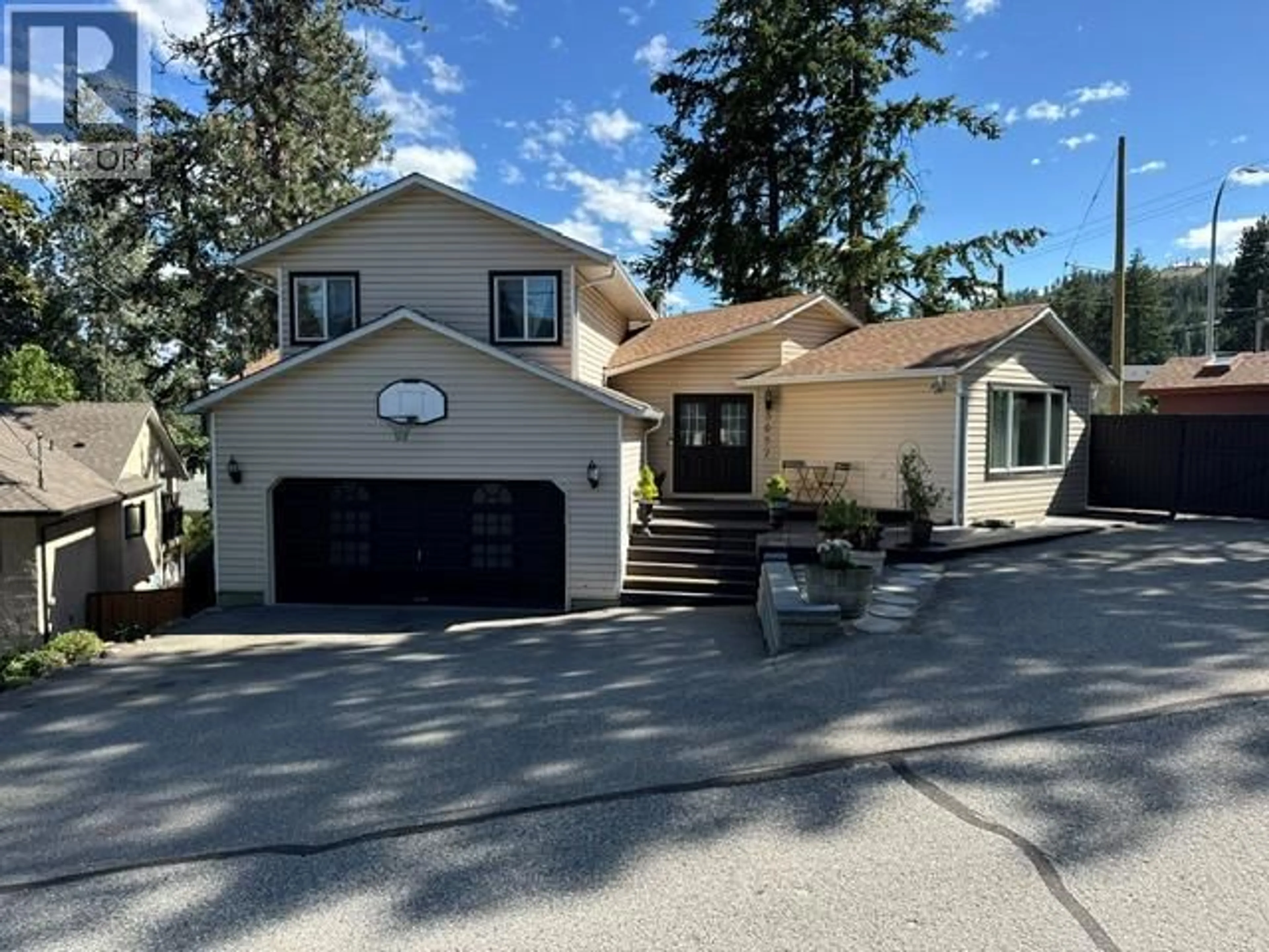 Home with vinyl exterior material, street for 3037 COUNTRY HILLS LANE, West Kelowna British Columbia V4T1C3