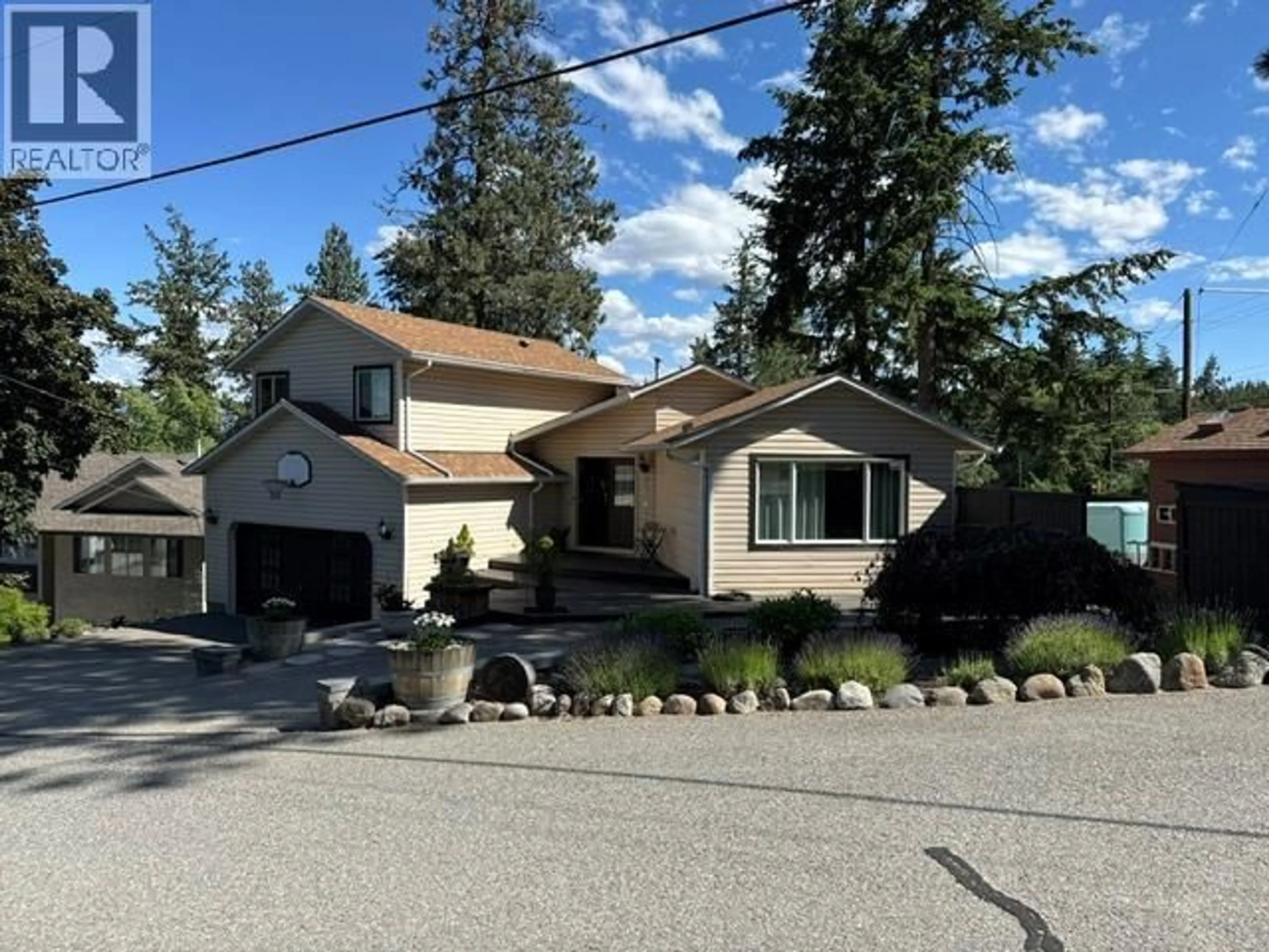 Home with vinyl exterior material, street for 3037 COUNTRY HILLS LANE, West Kelowna British Columbia V4T1C3