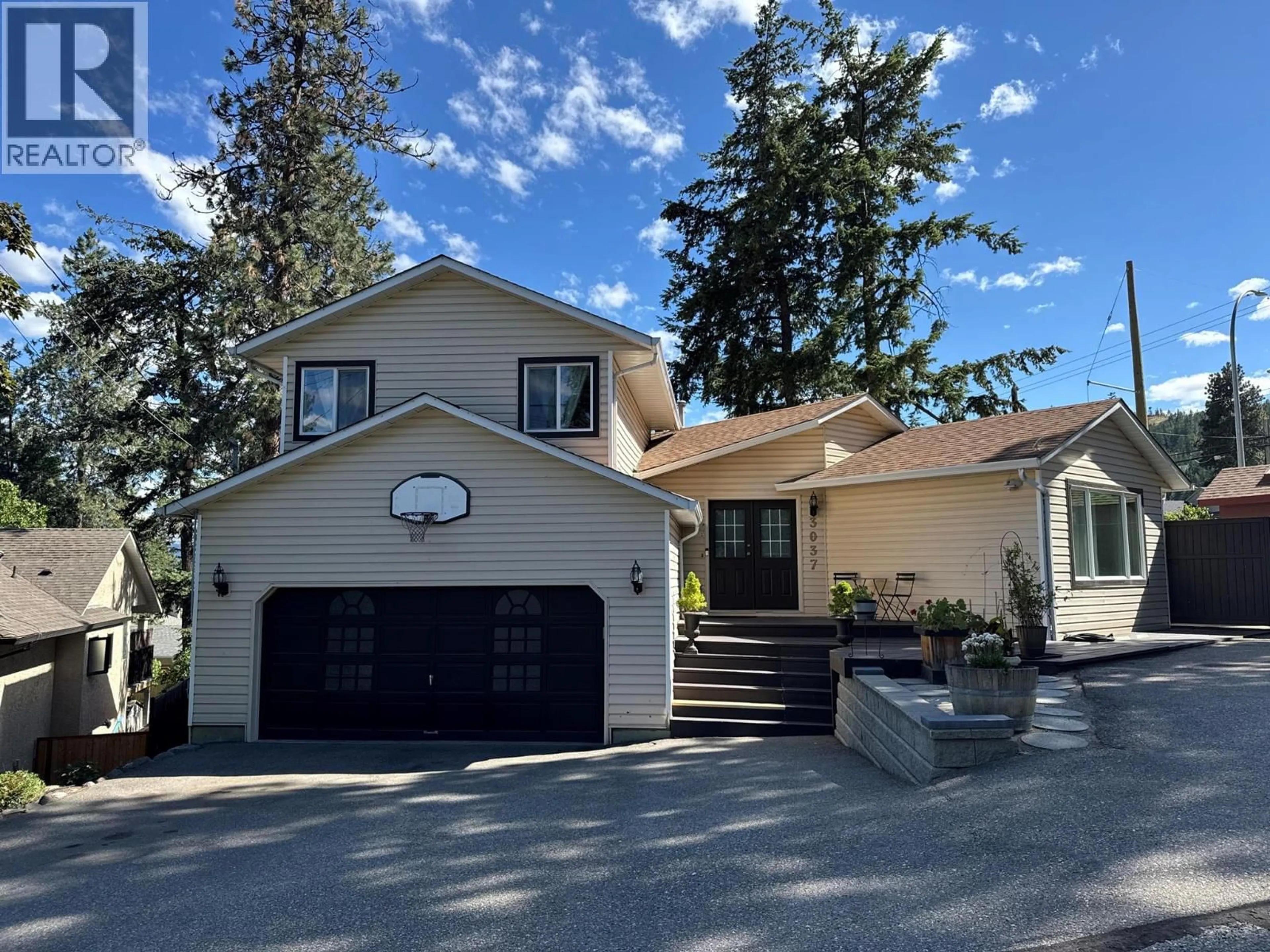 Home with vinyl exterior material, street for 3037 COUNTRY HILLS LANE, West Kelowna British Columbia V4T1C3