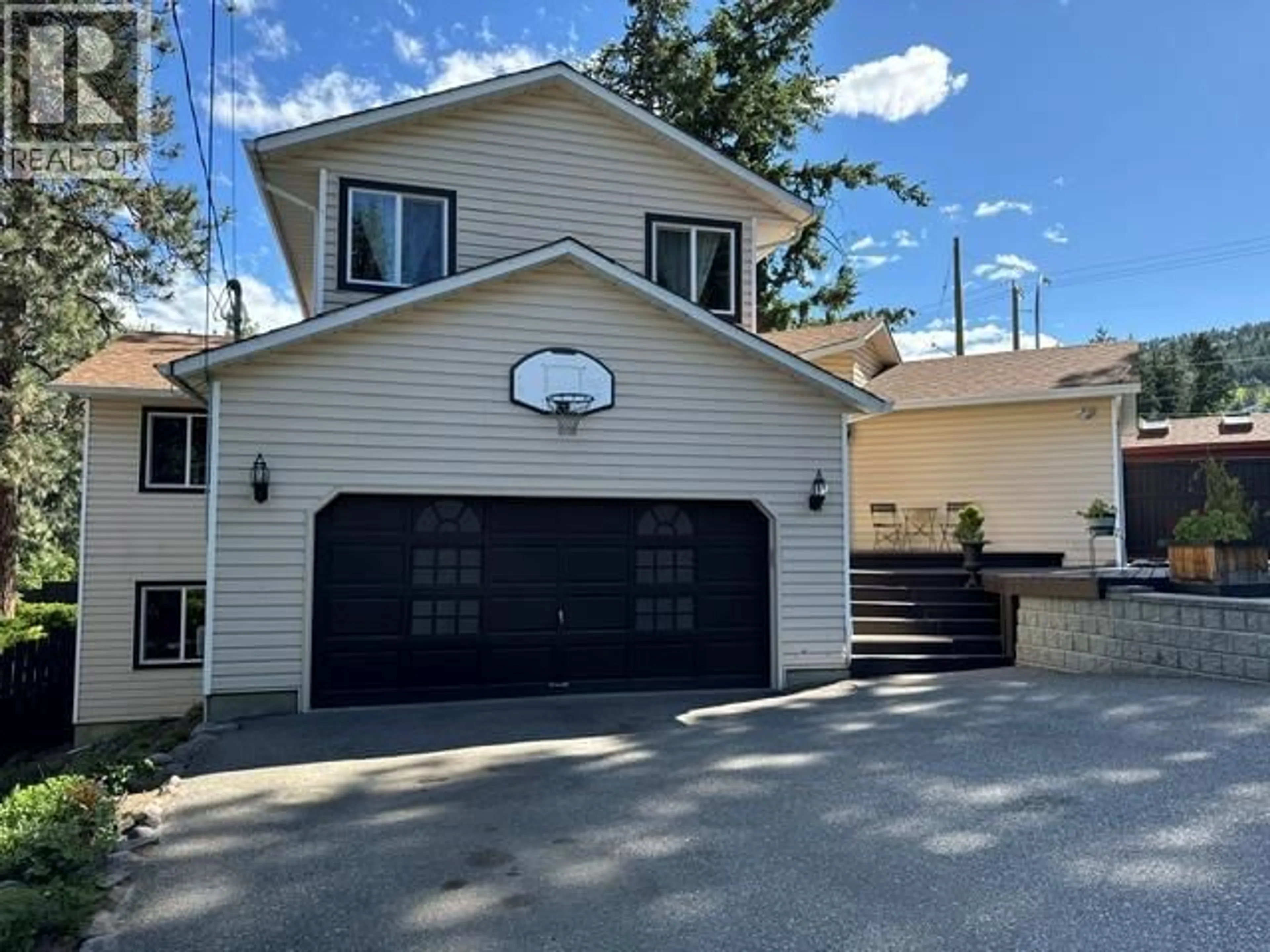 Home with vinyl exterior material, street for 3037 COUNTRY HILLS LANE, West Kelowna British Columbia V4T1C3
