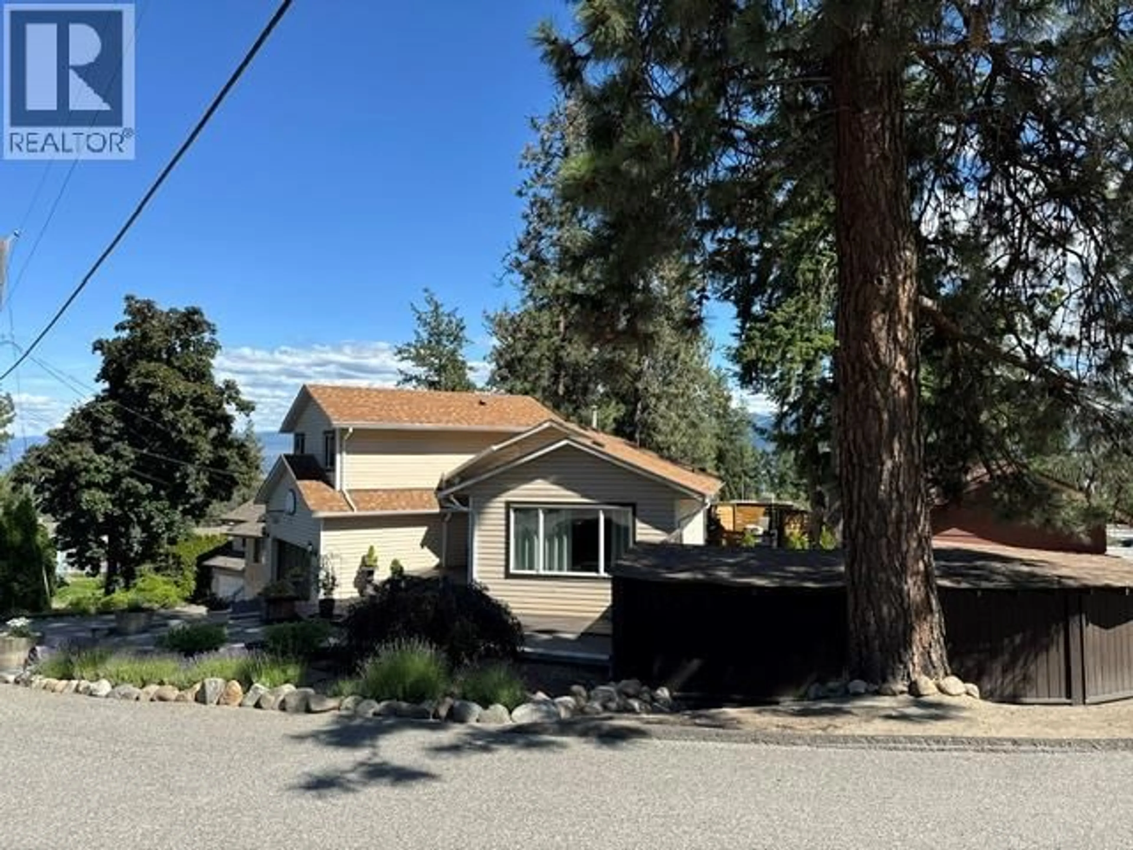 A pic from outside/outdoor area/front of a property/back of a property/a pic from drone, street for 3037 COUNTRY HILLS LANE, West Kelowna British Columbia V4T1C3