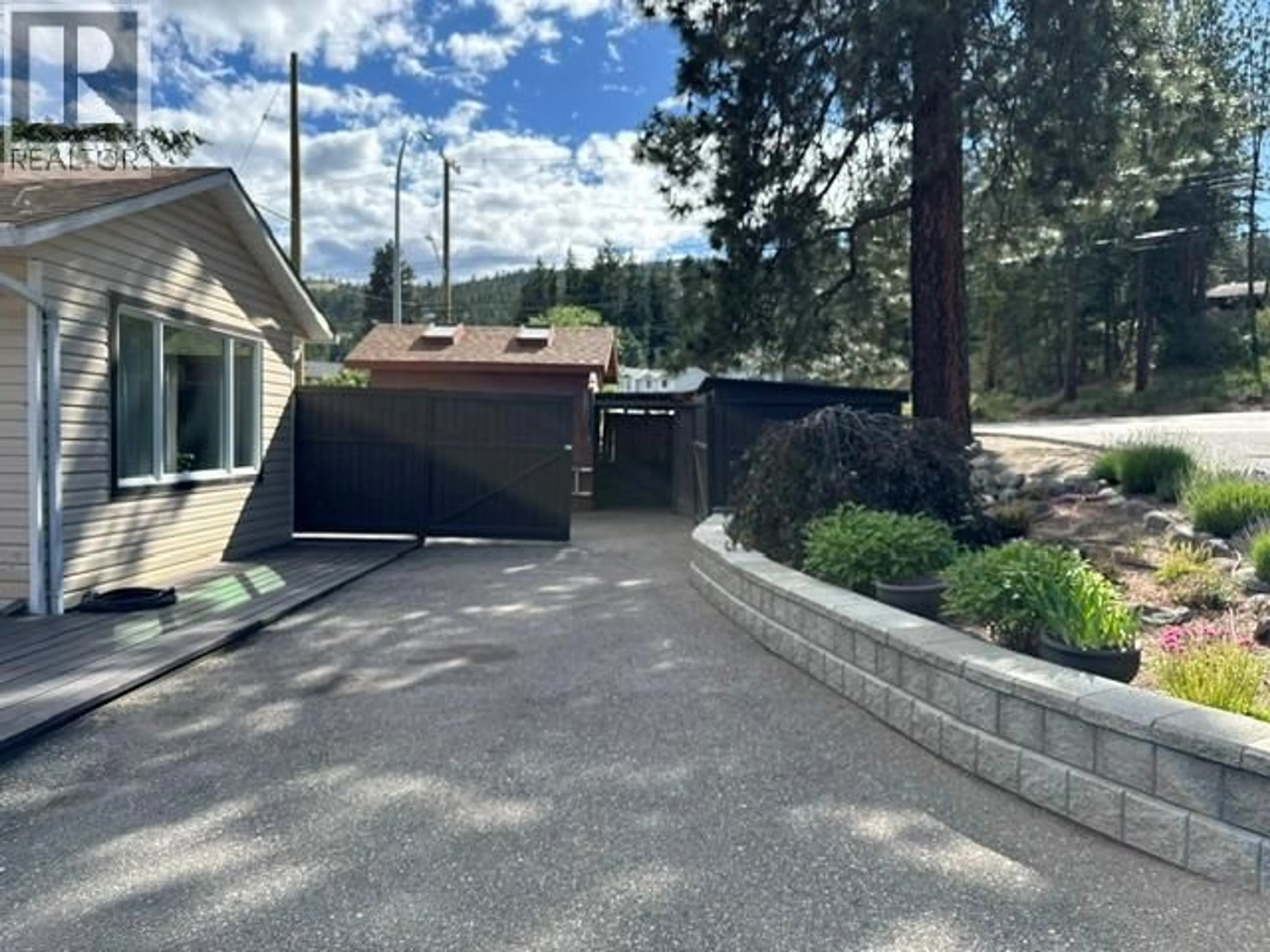 A pic from outside/outdoor area/front of a property/back of a property/a pic from drone, street for 3037 COUNTRY HILLS LANE, West Kelowna British Columbia V4T1C3