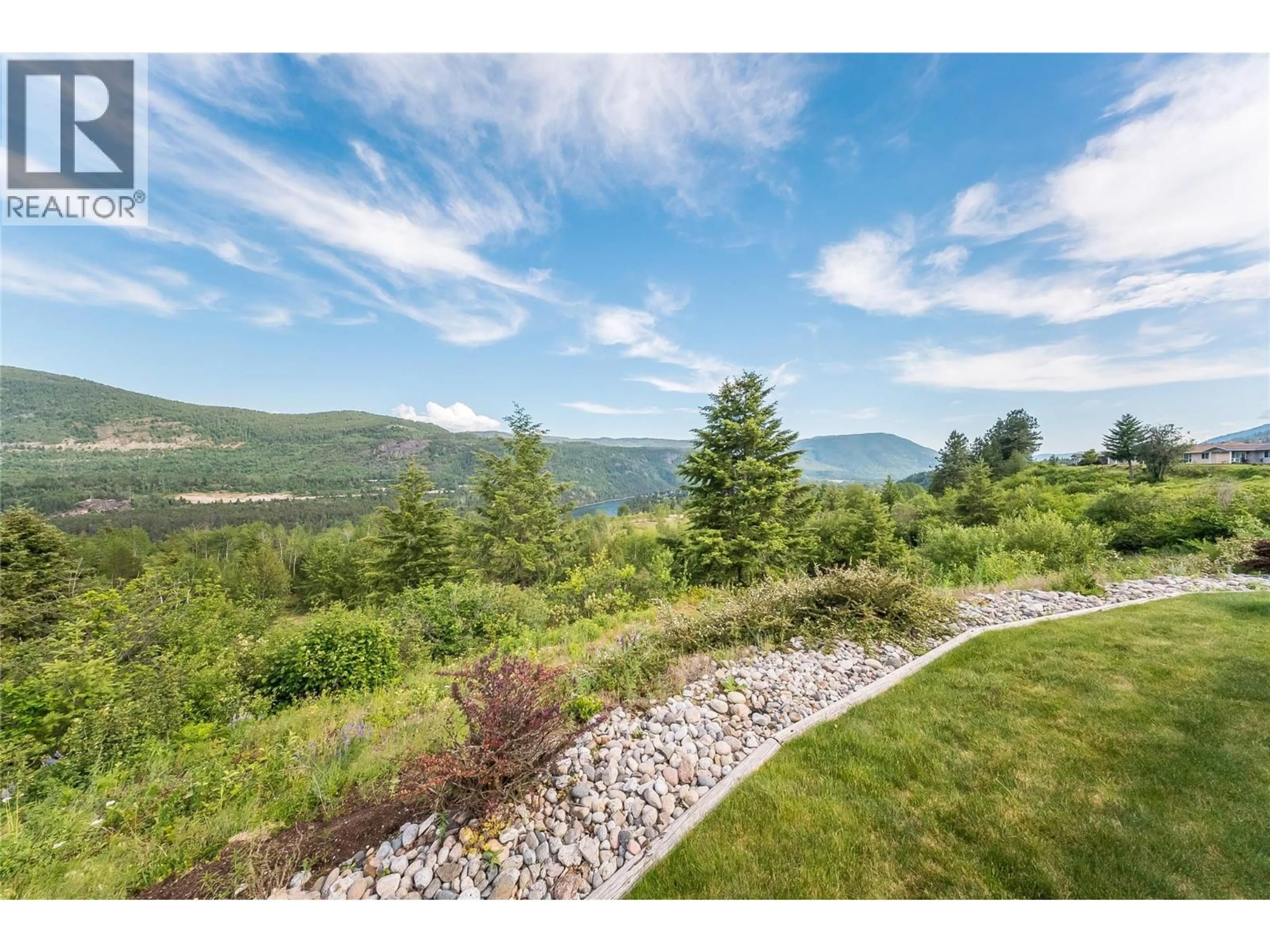 A pic from outside/outdoor area/front of a property/back of a property/a pic from drone, mountain view for 115 - 4200 GRANDVIEW DRIVE, Castlegar British Columbia V1N4X6