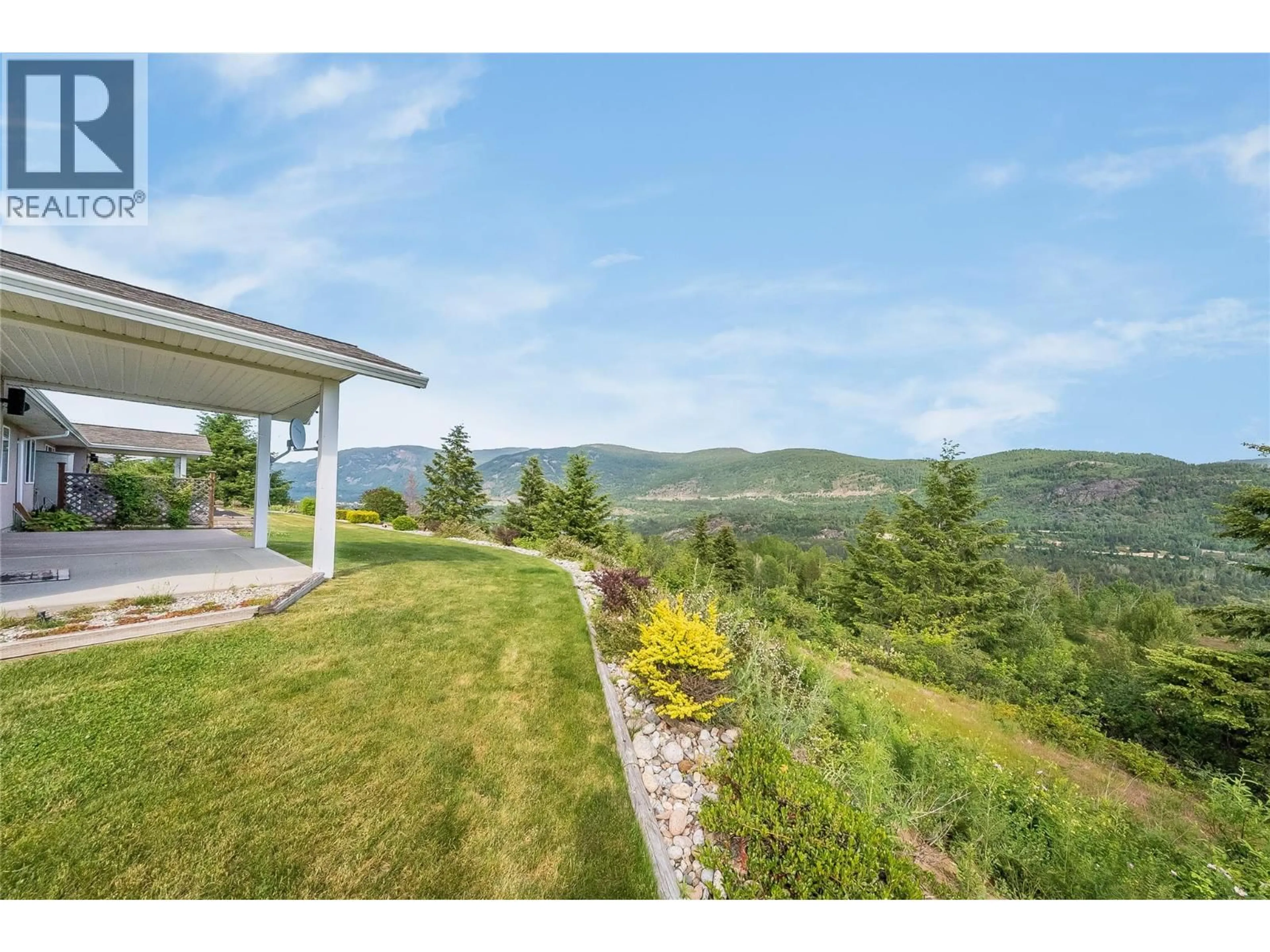 A pic from outside/outdoor area/front of a property/back of a property/a pic from drone, mountain view for 115 - 4200 GRANDVIEW DRIVE, Castlegar British Columbia V1N4X6