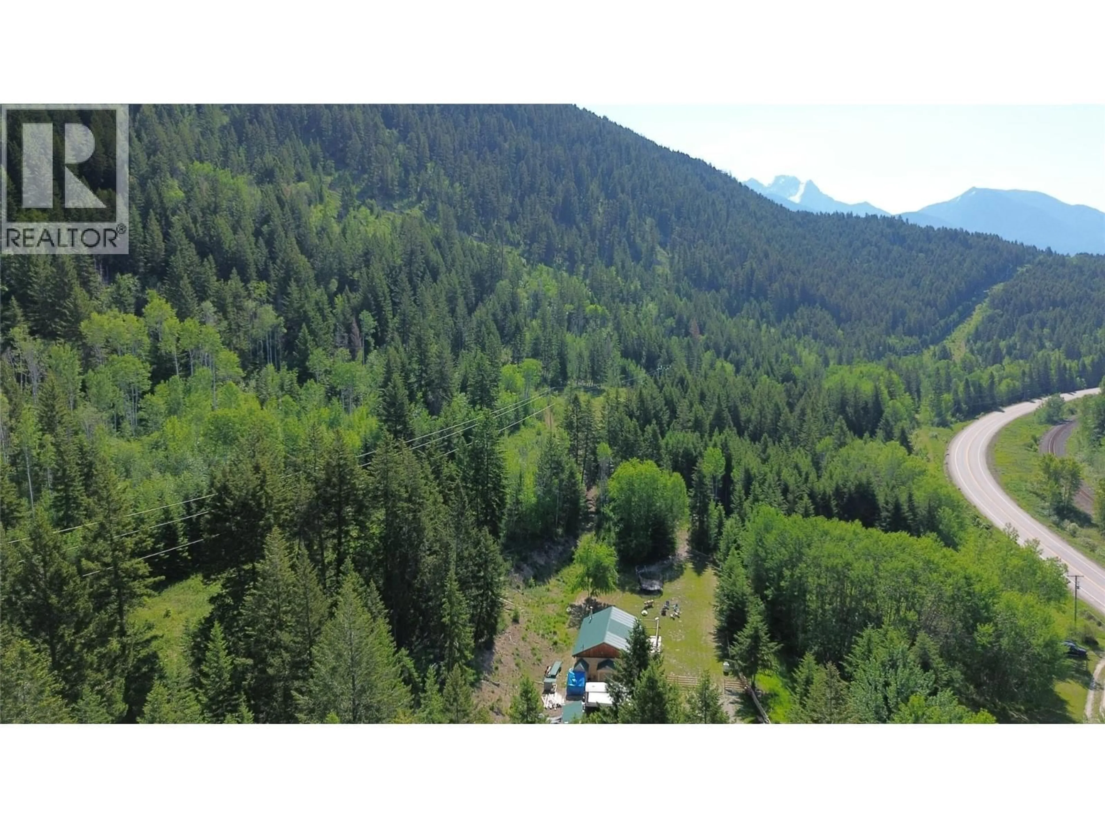 A pic from outside/outdoor area/front of a property/back of a property/a pic from drone, forest/trees view for 5055 95 HIGHWAY, Castledale British Columbia V0A1J0