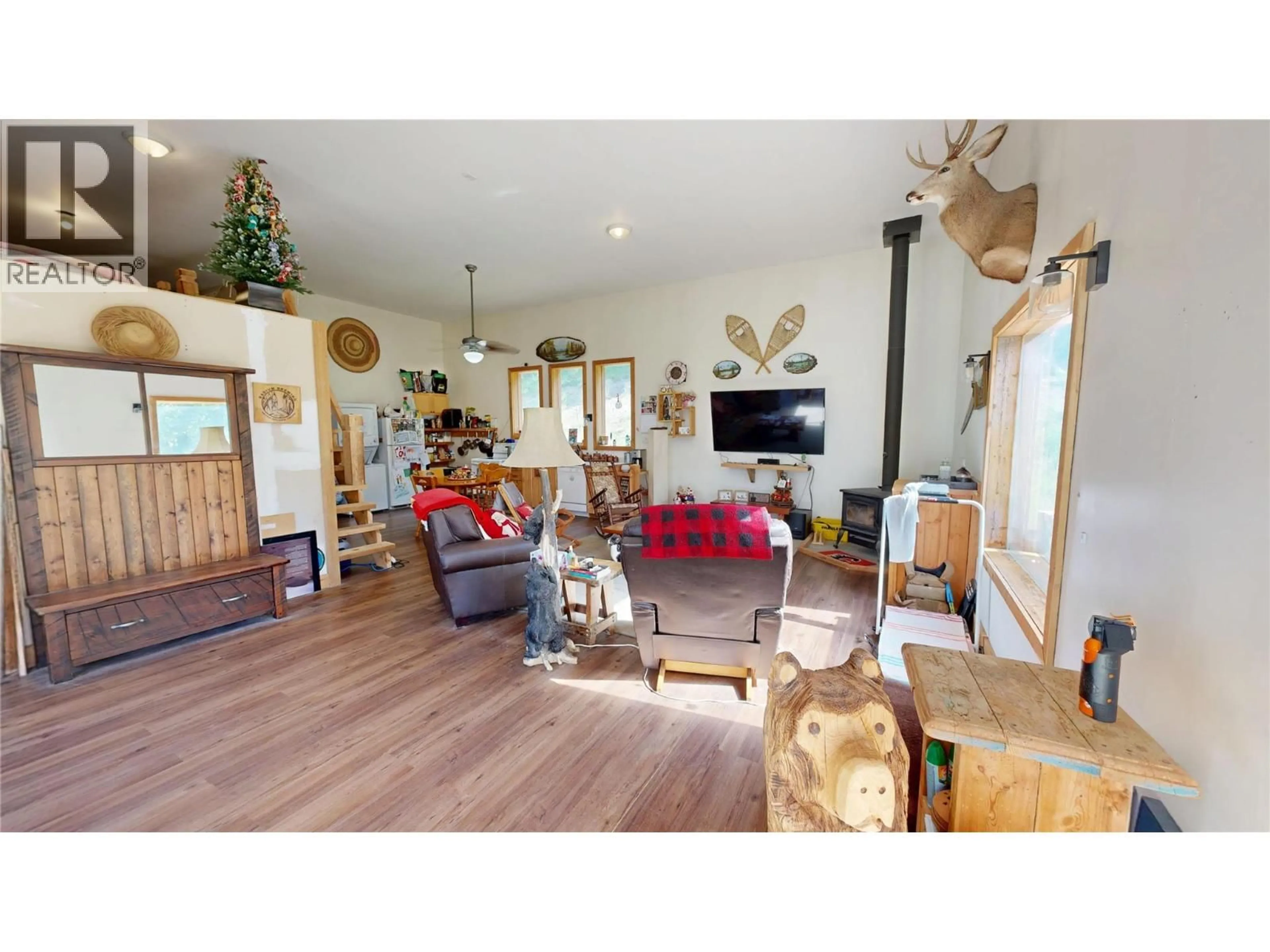 Living room with furniture, wood/laminate floor for 5055 95 HIGHWAY, Castledale British Columbia V0A1J0