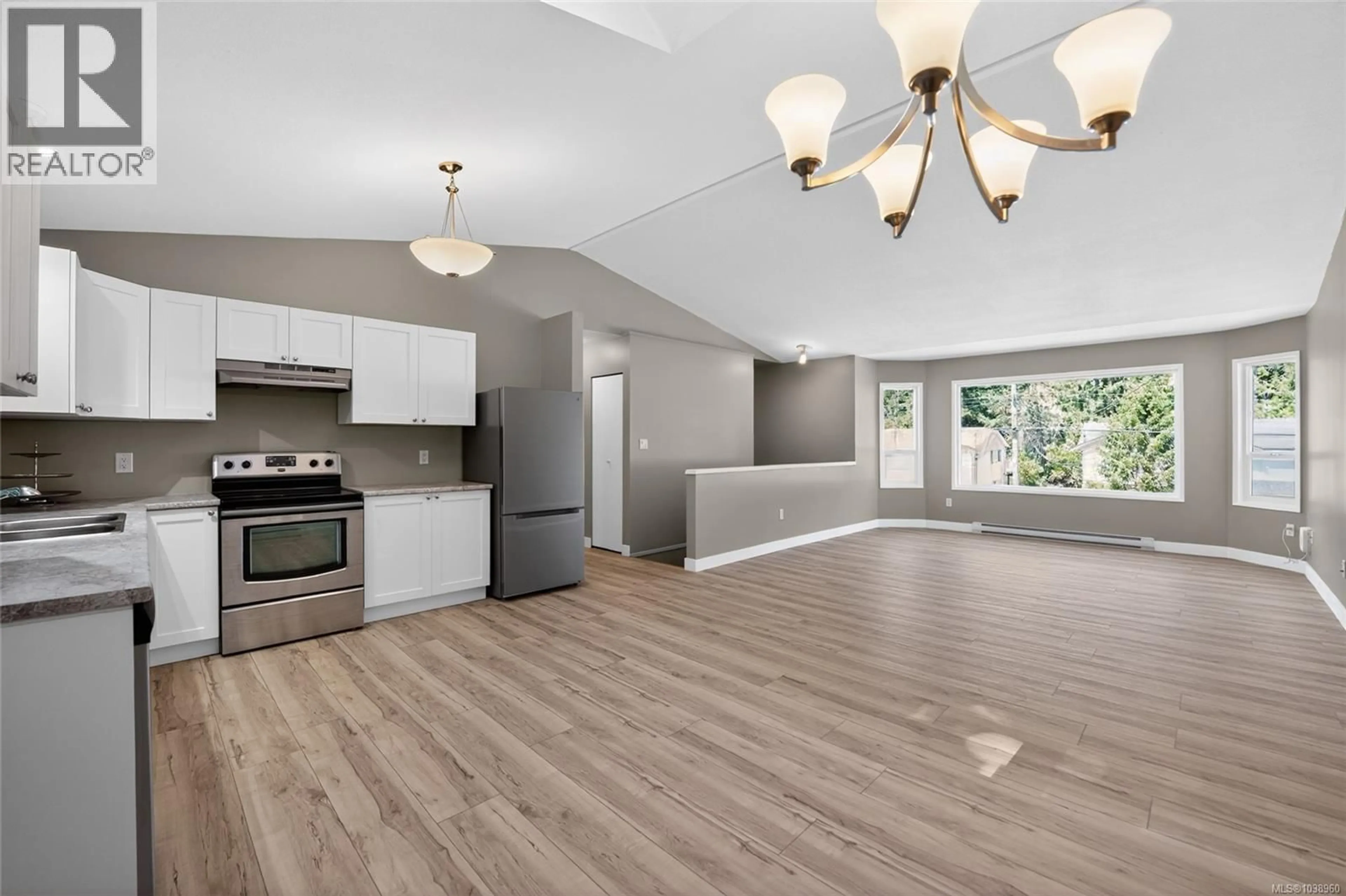 Open concept kitchen, wood/laminate floor for 5691 BROOKWOOD DRIVE, Nanaimo British Columbia V9T5P3