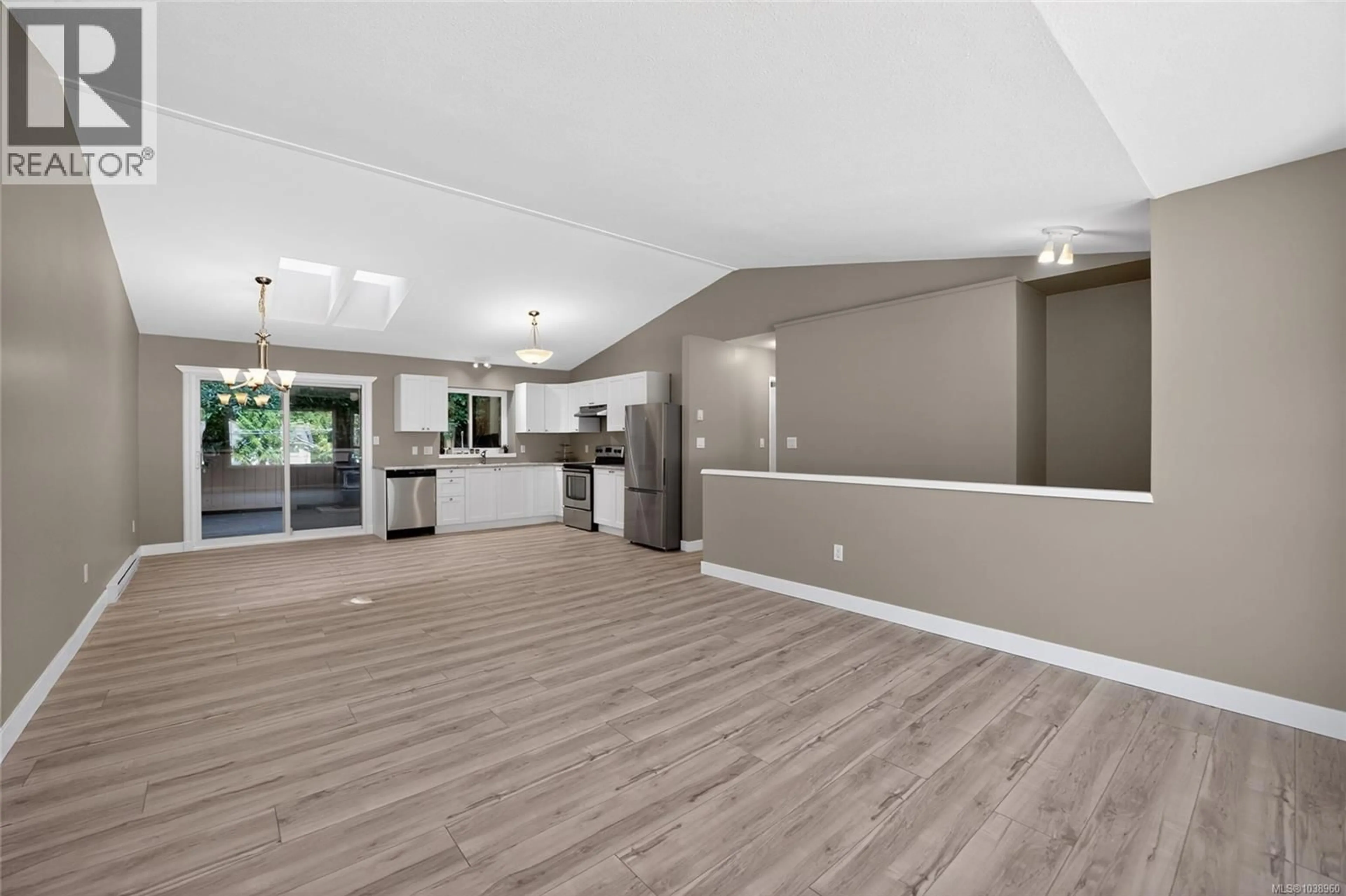Open concept kitchen, wood/laminate floor for 5691 BROOKWOOD DRIVE, Nanaimo British Columbia V9T5P3