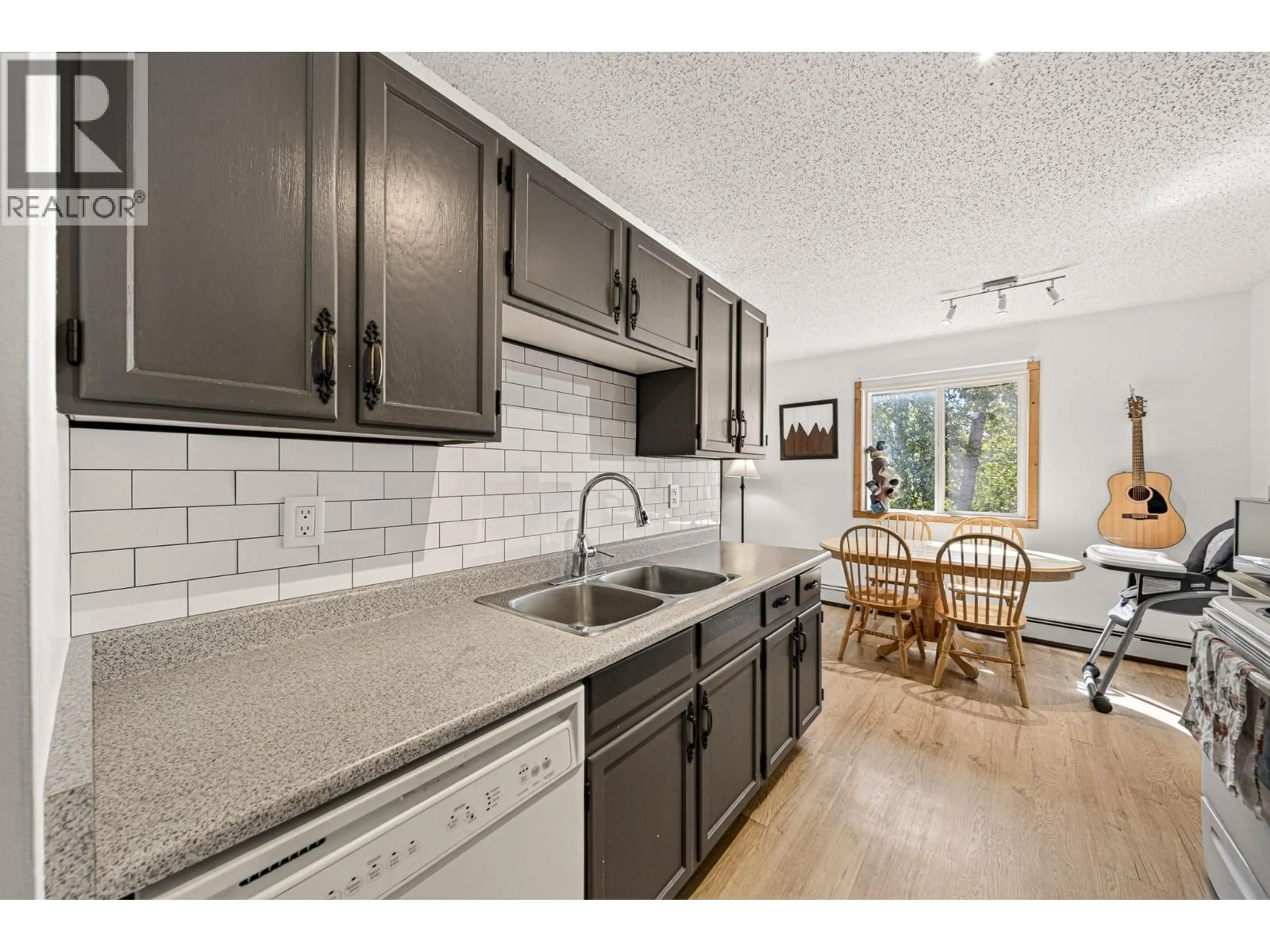 Open concept kitchen, ceramic/tile floor for 308 - 65 COKATO ROAD, Fernie British Columbia V0B1M4
