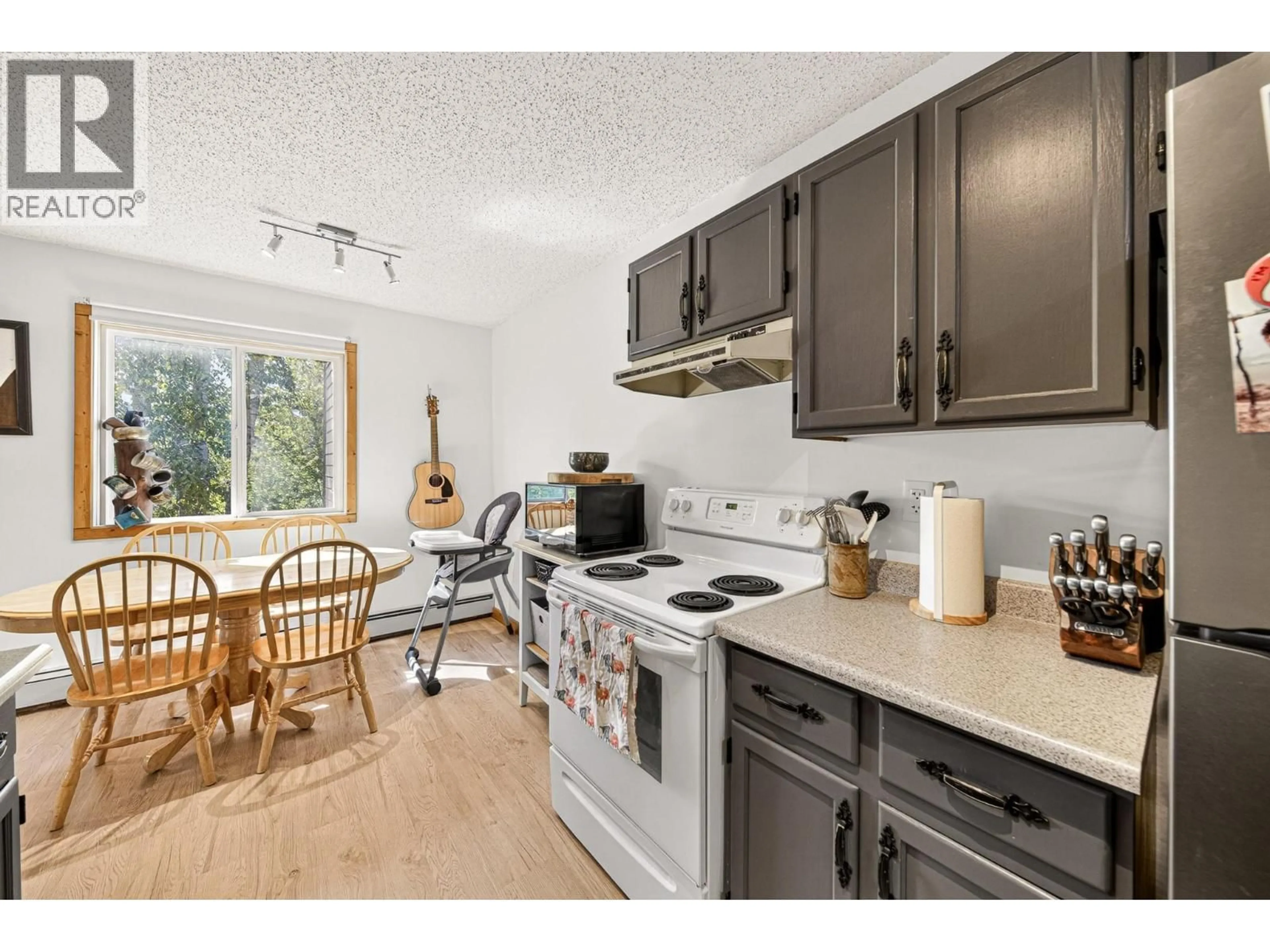 Open concept kitchen, wood/laminate floor for 308 - 65 COKATO ROAD, Fernie British Columbia V0B1M4