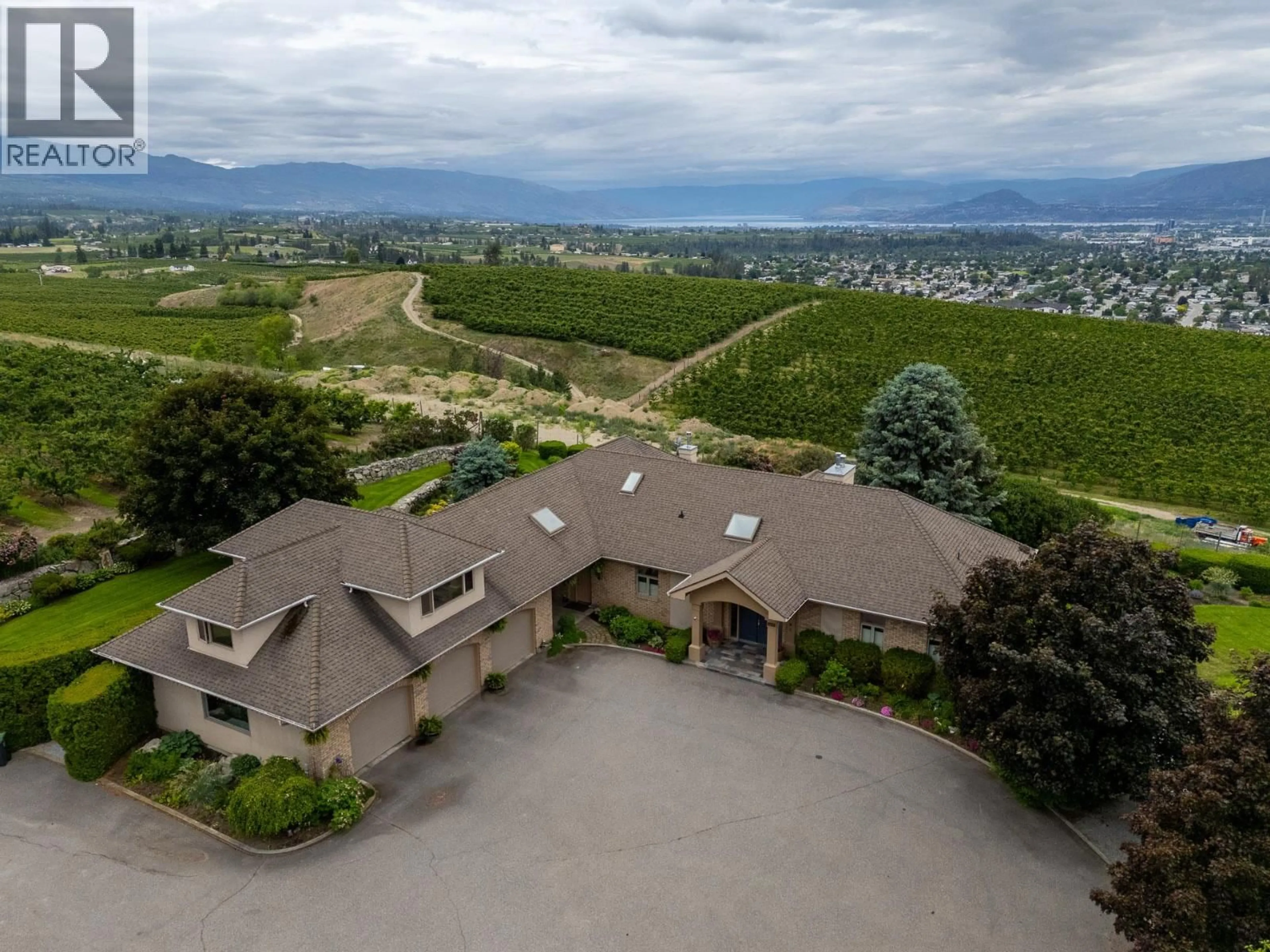 A pic from outside/outdoor area/front of a property/back of a property/a pic from drone, mountain view for 1145 MCKENZIE ROAD, Kelowna British Columbia V1P1C3