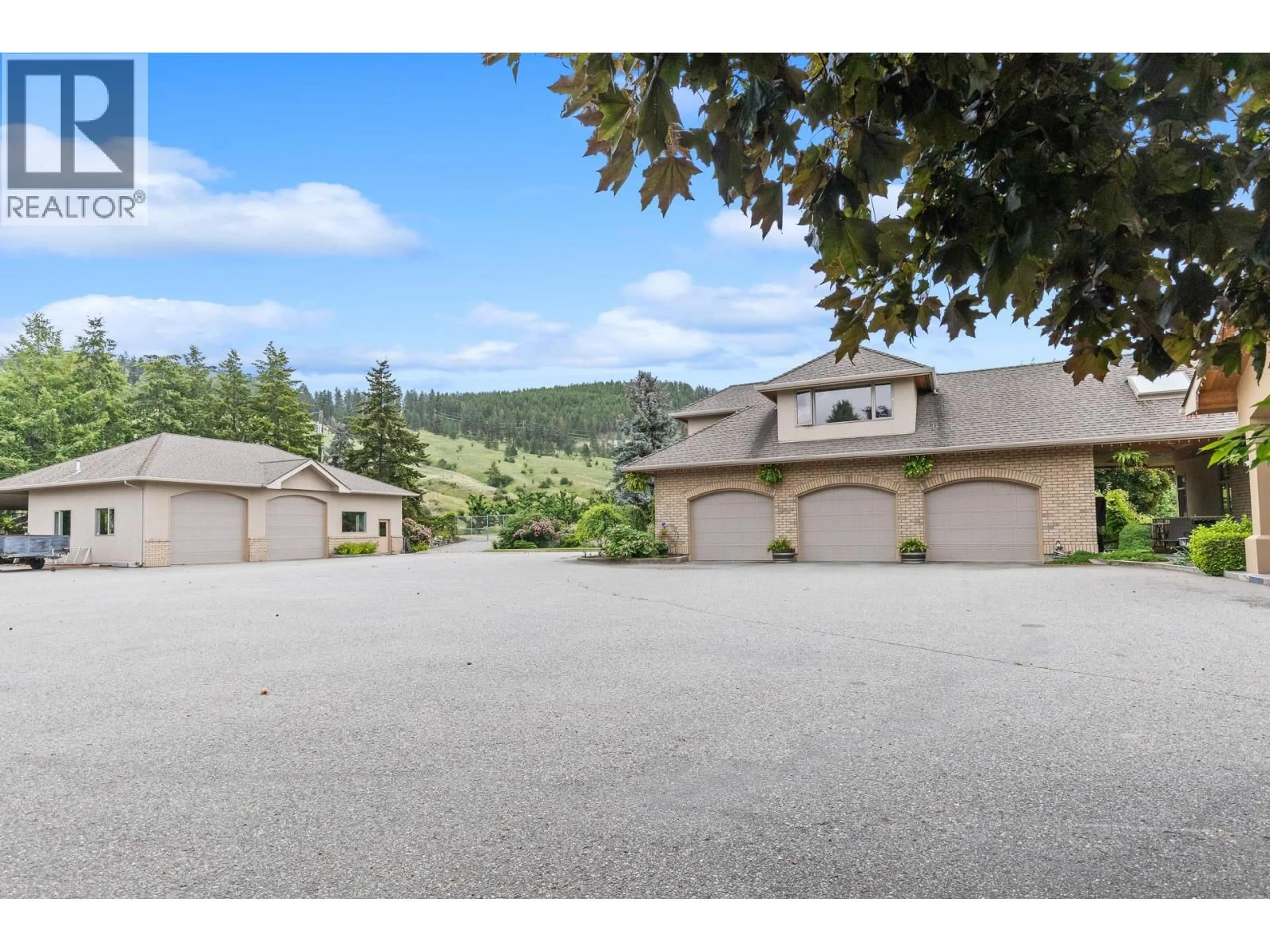 A pic from outside/outdoor area/front of a property/back of a property/a pic from drone, mountain view for 1145 MCKENZIE ROAD, Kelowna British Columbia V1P1C3
