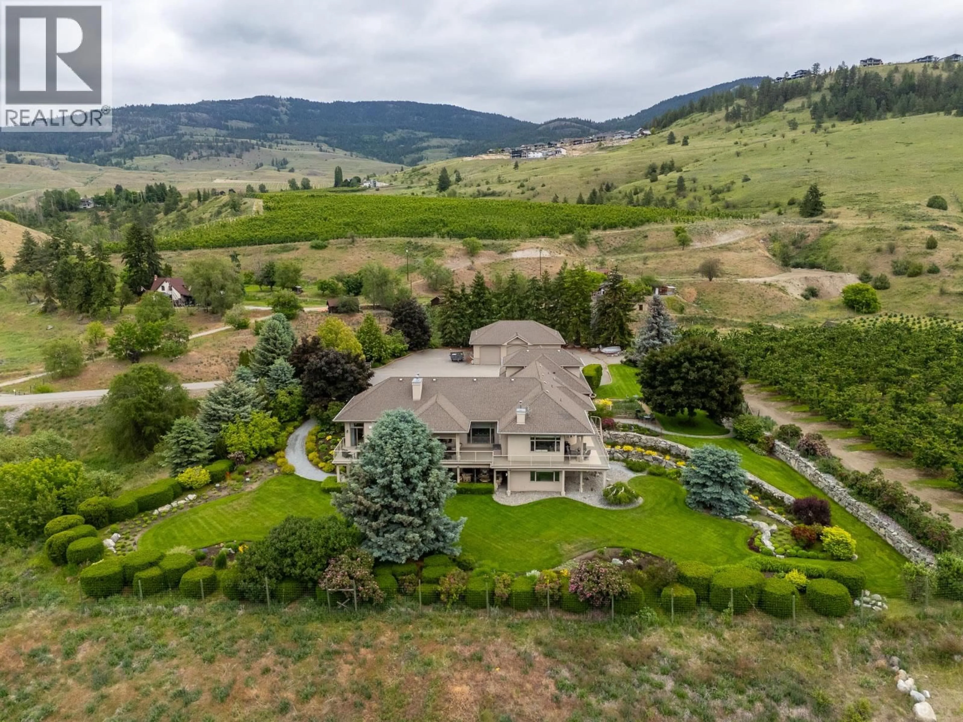 A pic from outside/outdoor area/front of a property/back of a property/a pic from drone, mountain view for 1145 MCKENZIE ROAD, Kelowna British Columbia V1P1C3