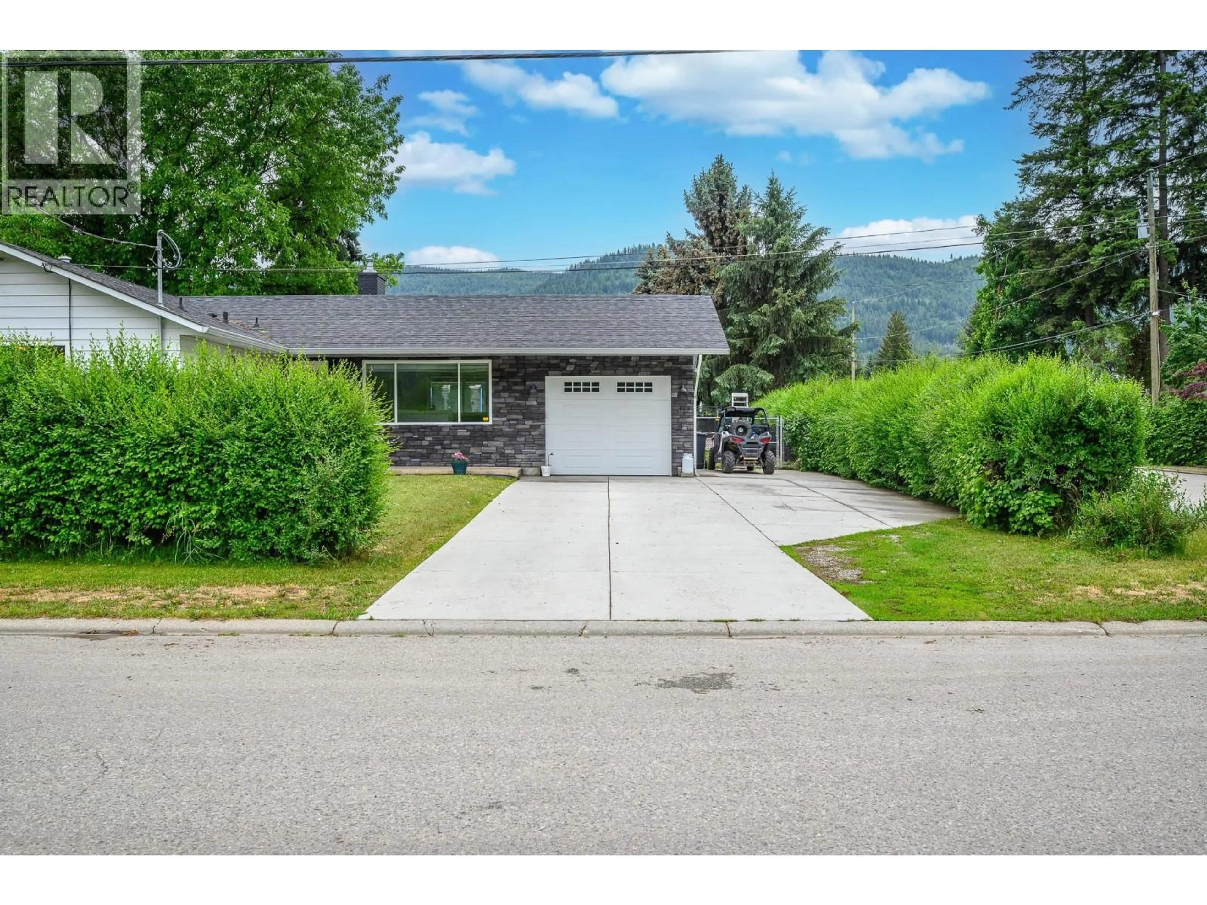 A pic from outside/outdoor area/front of a property/back of a property/a pic from drone, mountain view for 6596 LAVINGTON WAY, Coldstream British Columbia V1B3G5