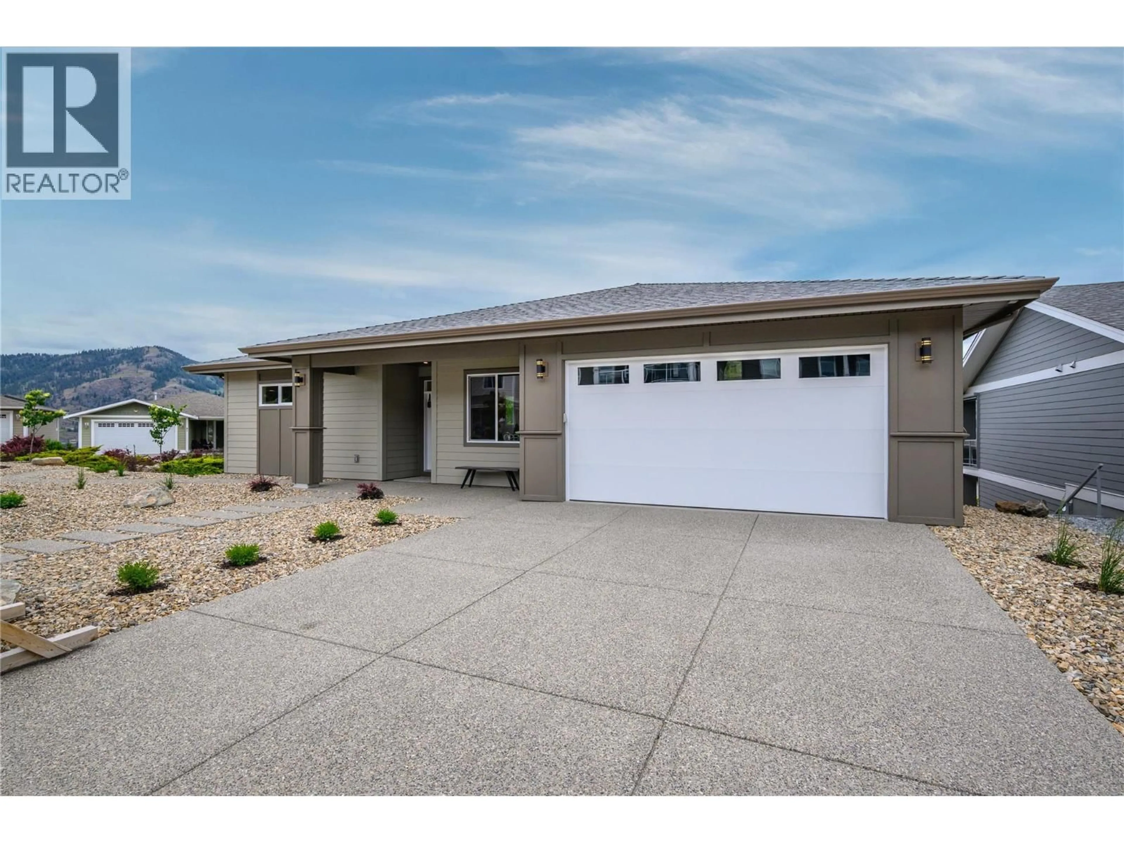 Home with vinyl exterior material, street for 98 - 7760 OKANAGAN LANDING ROAD, Okanagan Landing British Columbia V1H1Z4