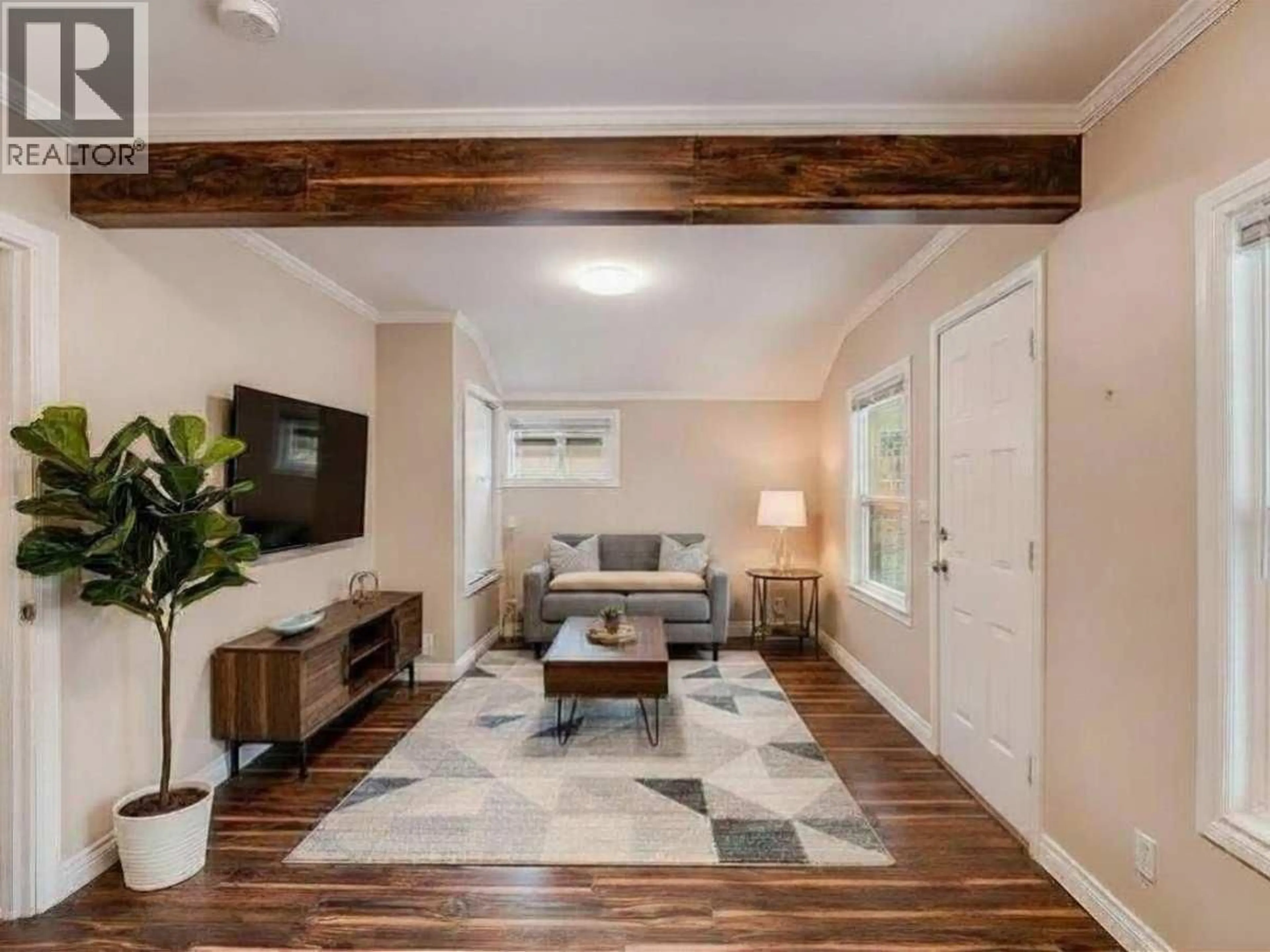 Living room with furniture, wood/laminate floor for 1767 SECOND AVENUE, Trail British Columbia V1R1M6
