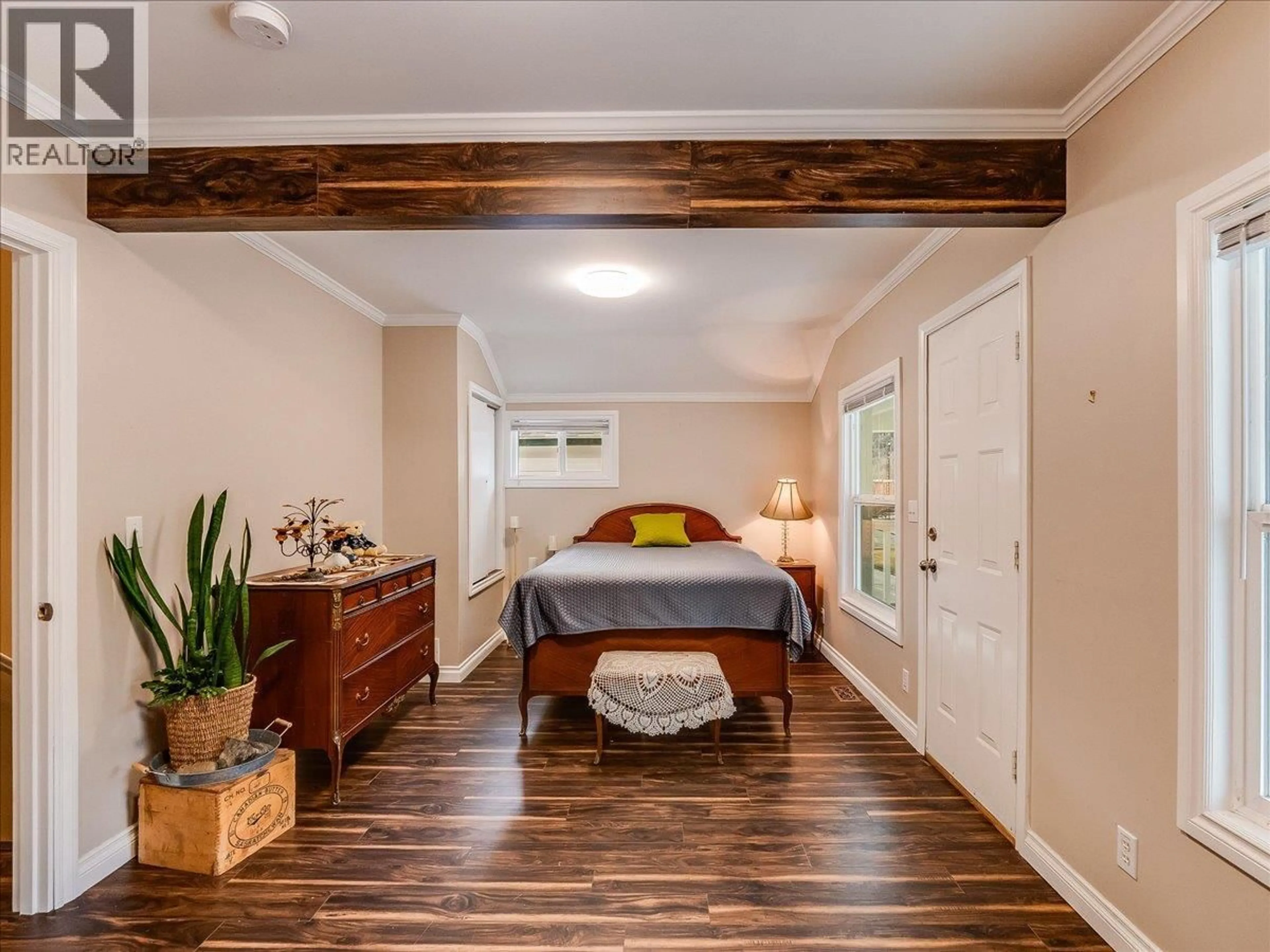 Bedroom with bed, wood/laminate floor for 1767 SECOND AVENUE, Trail British Columbia V1R1M6