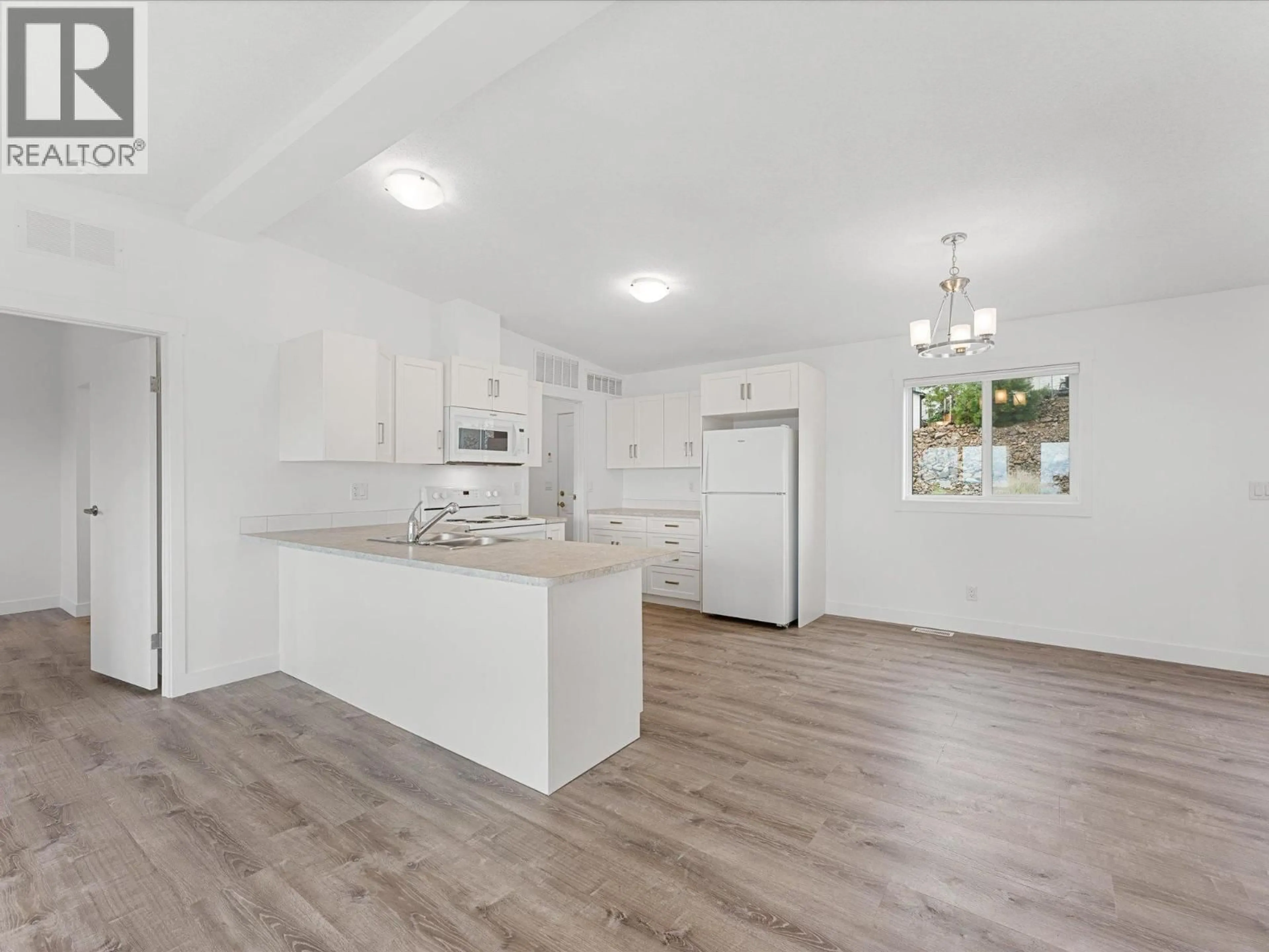 Open concept kitchen, unknown for 102 - 1750 LENZ ROAD, West Kelowna British Columbia V1Z3N1