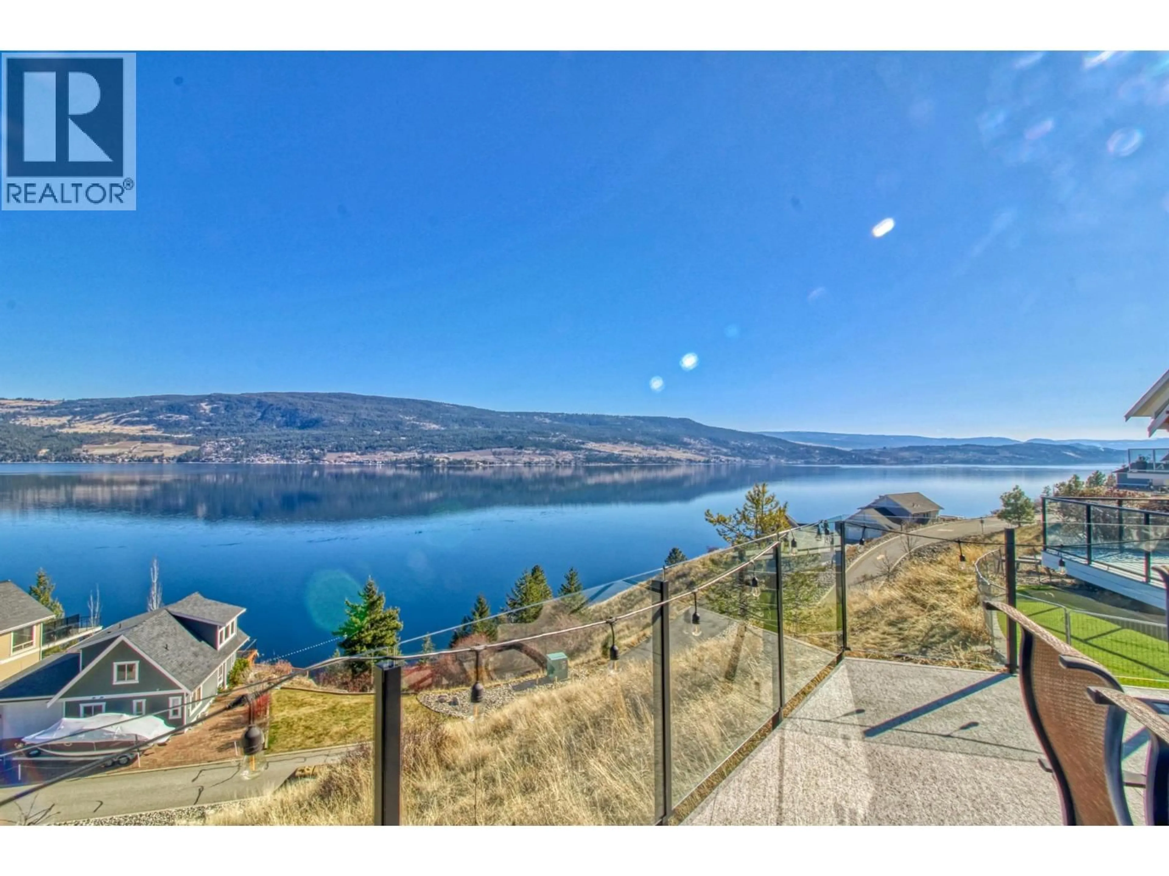 A pic from outside/outdoor area/front of a property/back of a property/a pic from drone, water/lake/river/ocean view for 62 - 6931 BARCELONA DRIVE, Kelowna British Columbia V1Z3R8