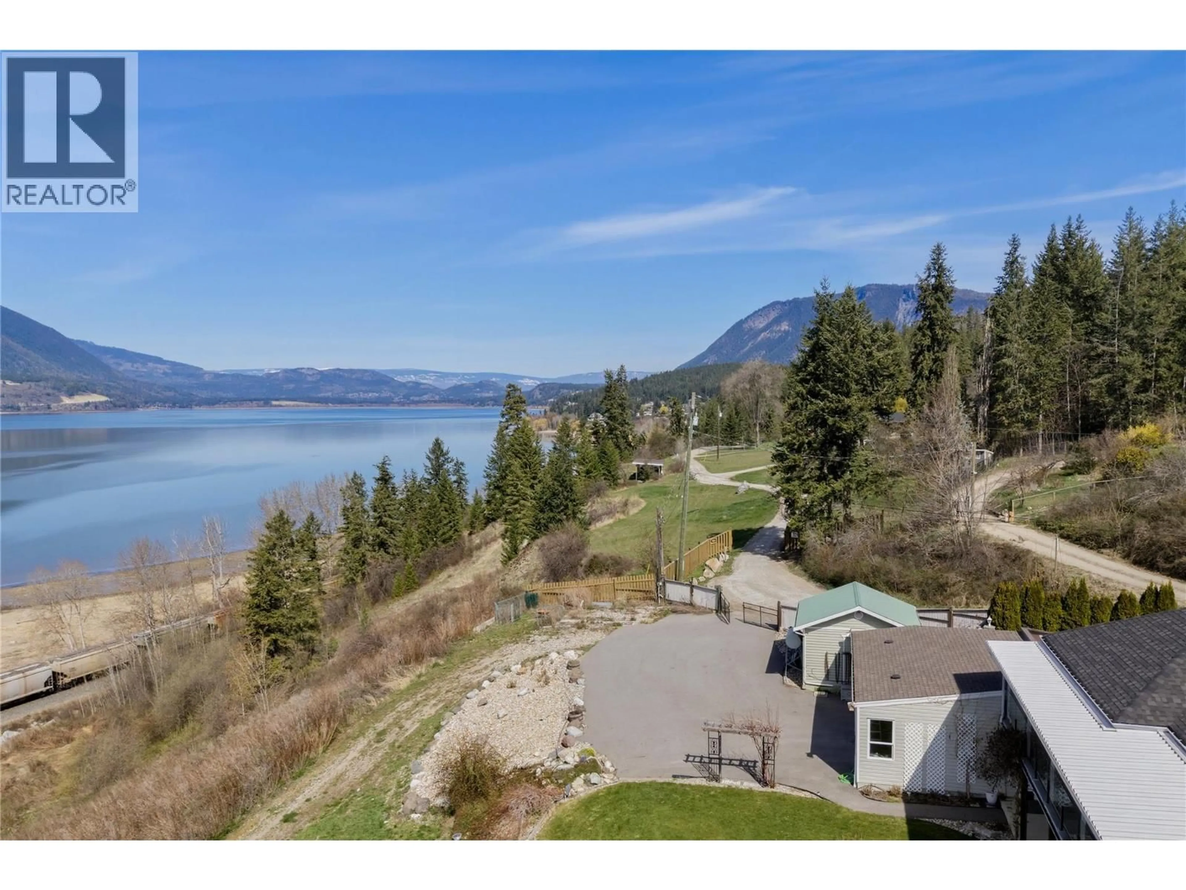 A pic from outside/outdoor area/front of a property/back of a property/a pic from drone, water/lake/river/ocean view for 1660 28 AVENUE NORTHEAST, Salmon Arm British Columbia V1E3X2