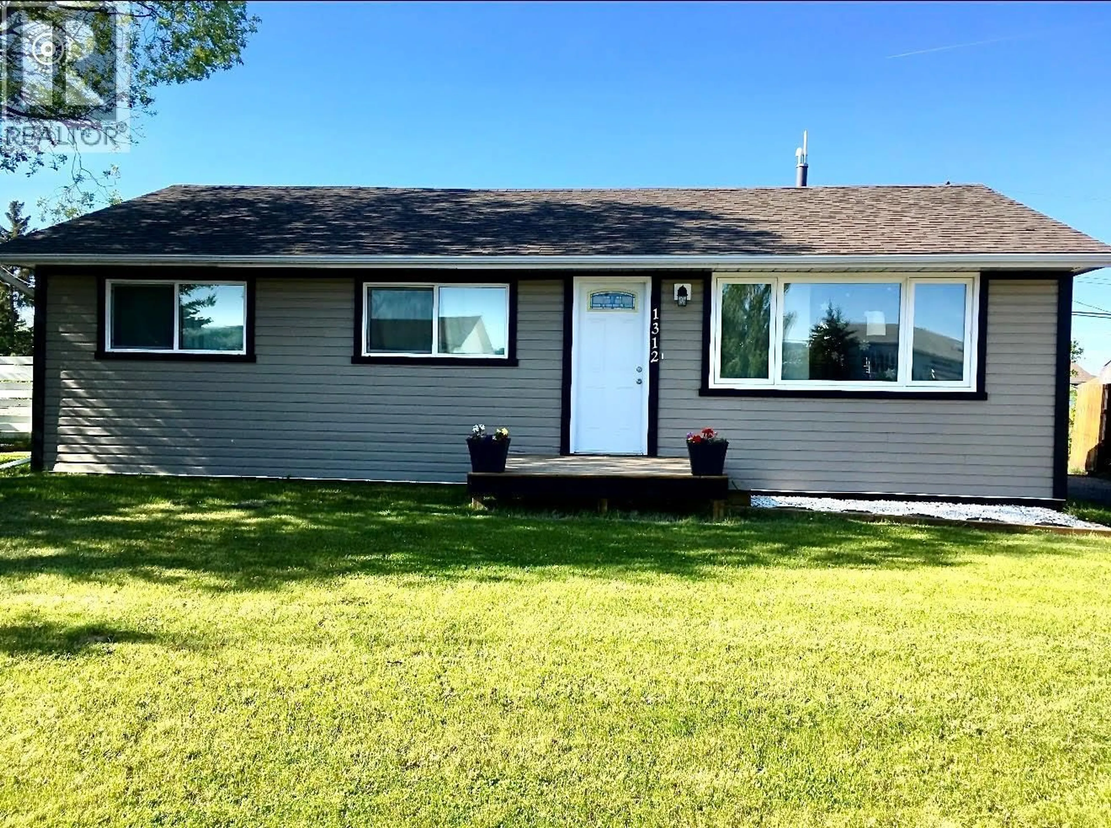 Home with vinyl exterior material, street for 1312 116 AVENUE, Dawson Creek British Columbia V1G3E7