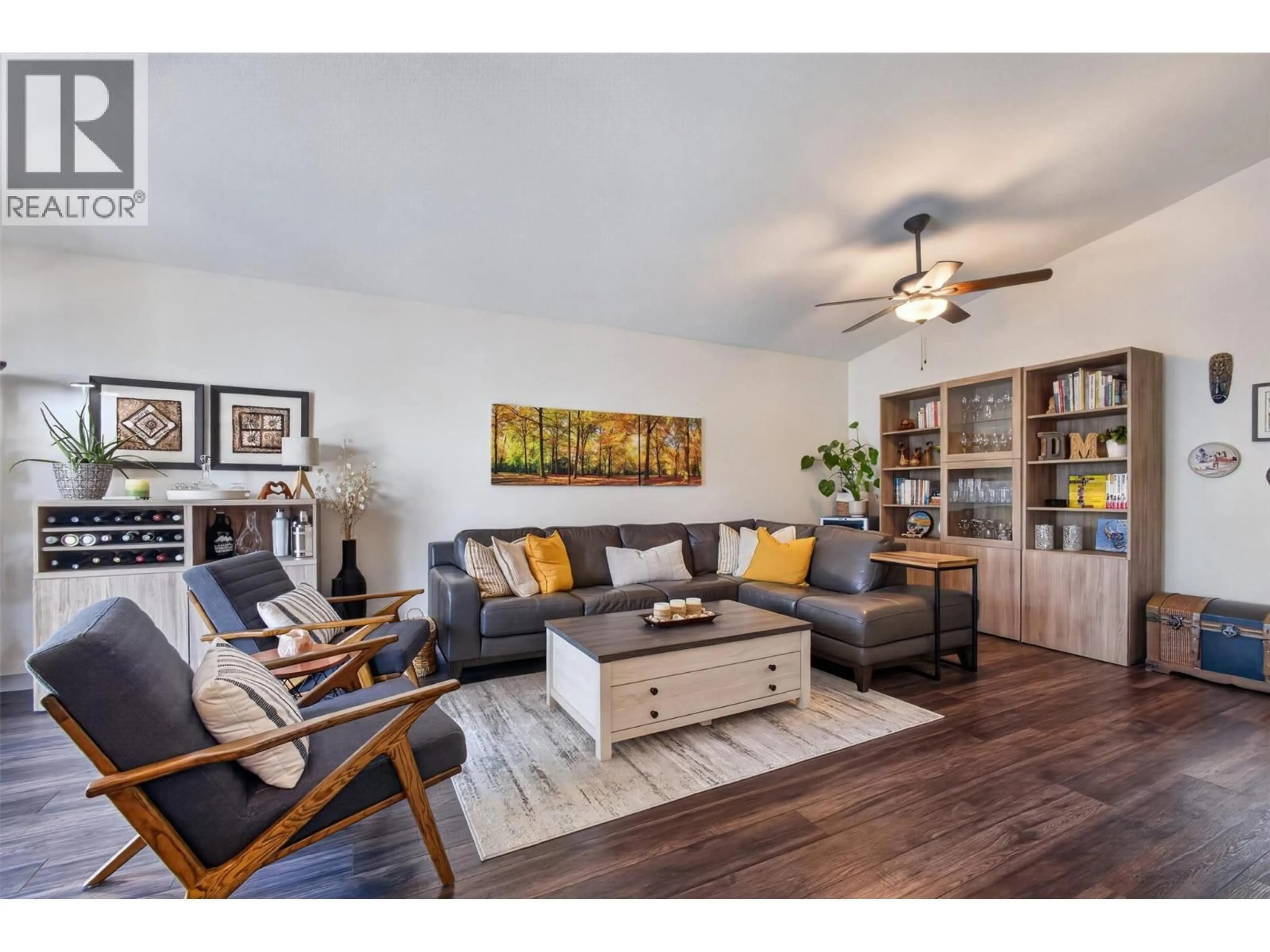 Living room with furniture, wood/laminate floor for 308 - 4630 PONDEROSA DRIVE, Peachland British Columbia V0X1H5