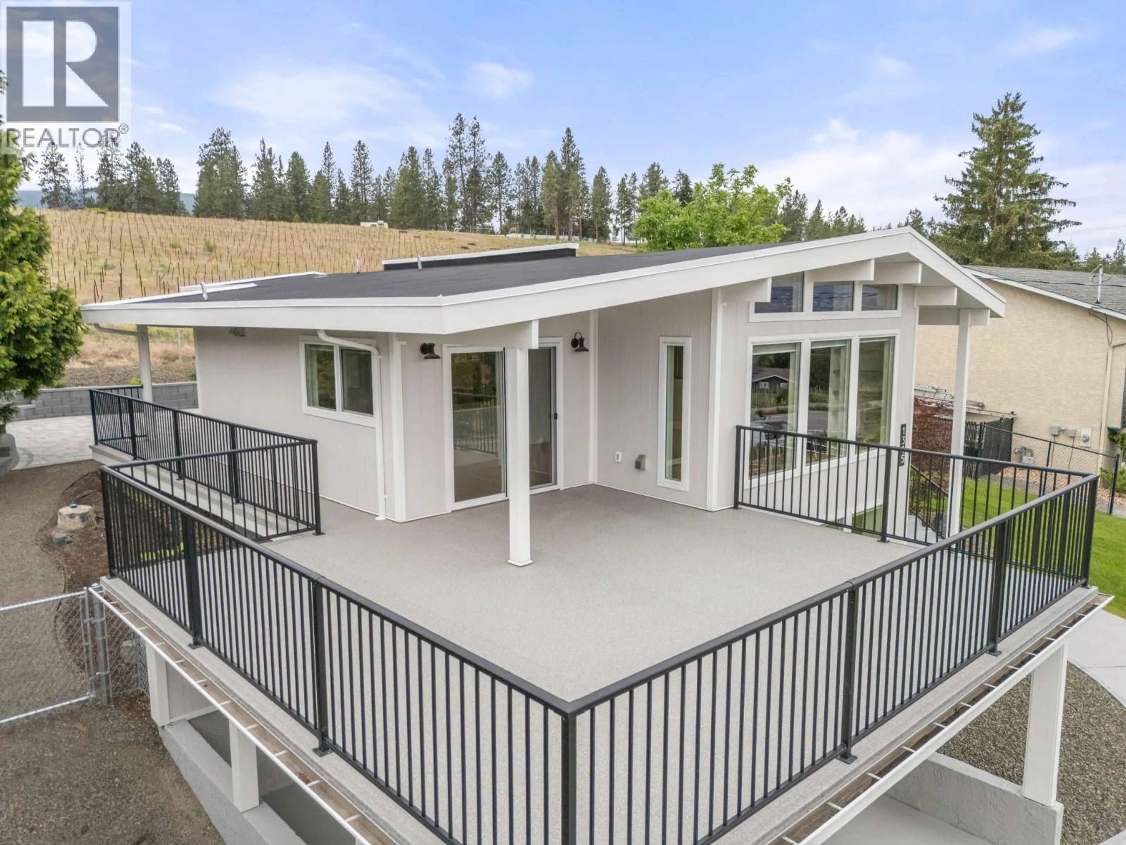 Home with vinyl exterior material, mountain view for 1315 DEHART ROAD, Kelowna British Columbia V1W4N3