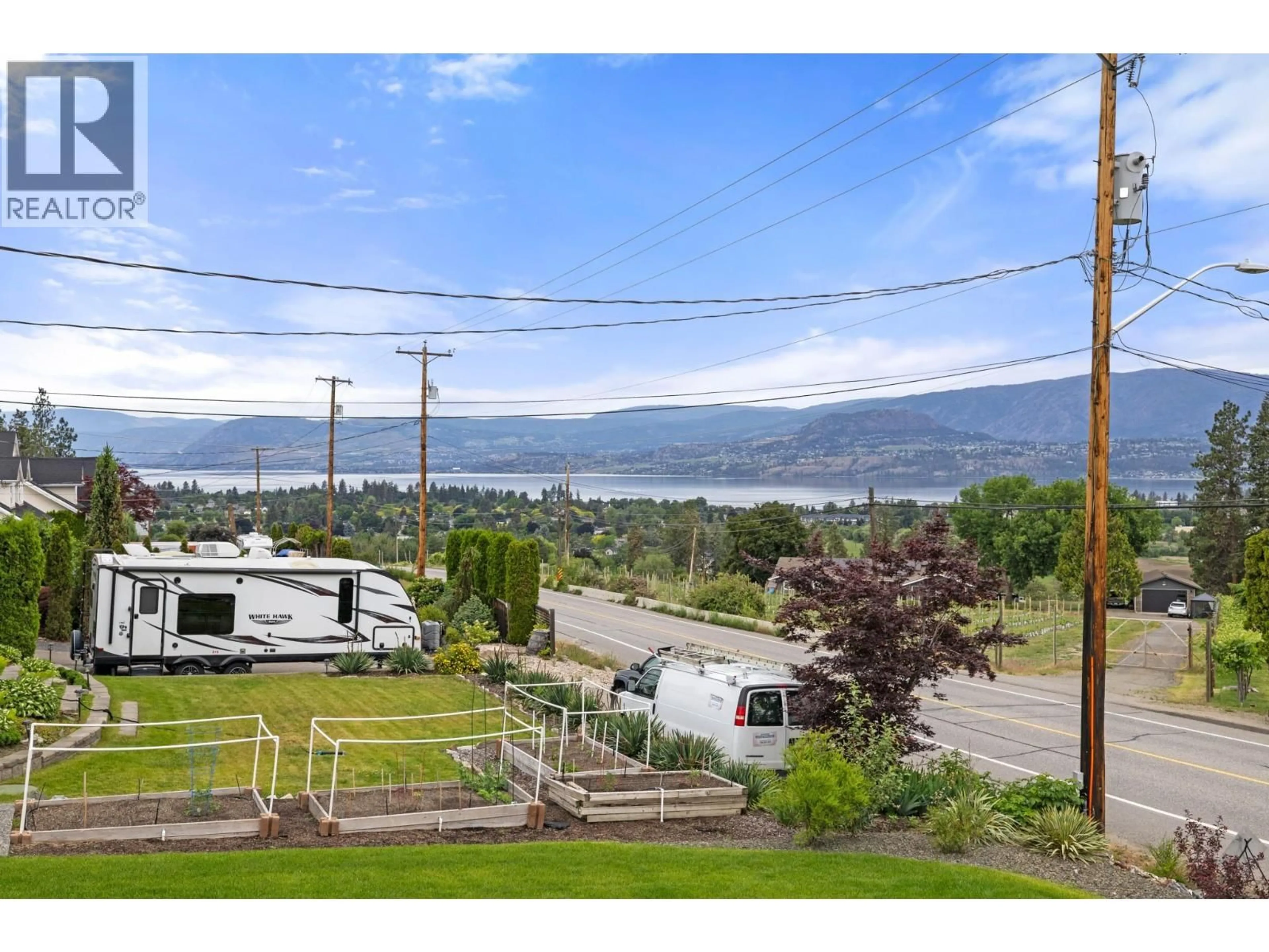 A pic from outside/outdoor area/front of a property/back of a property/a pic from drone, water/lake/river/ocean view for 1315 DEHART ROAD, Kelowna British Columbia V1W4N3