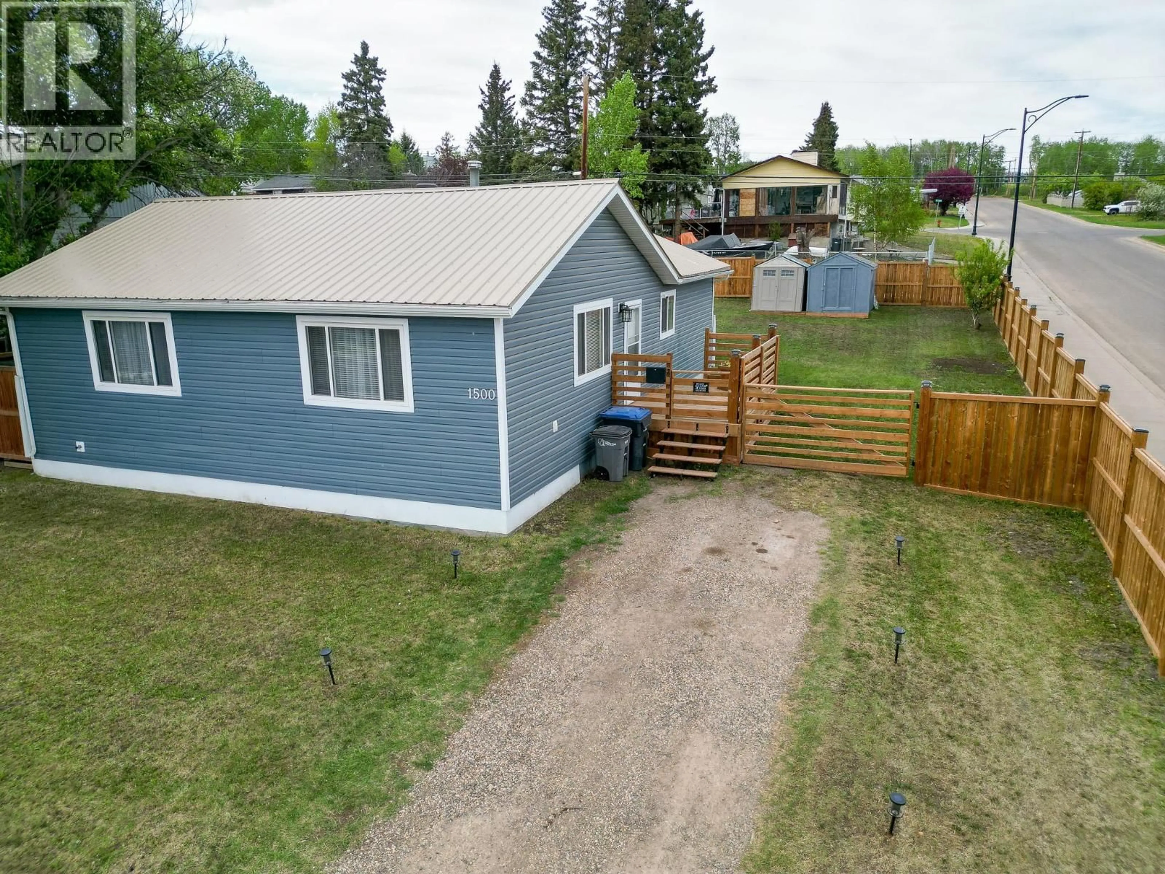 A pic from outside/outdoor area/front of a property/back of a property/a pic from drone, street for 1500 96 AVENUE, Dawson Creek British Columbia V1G1L6
