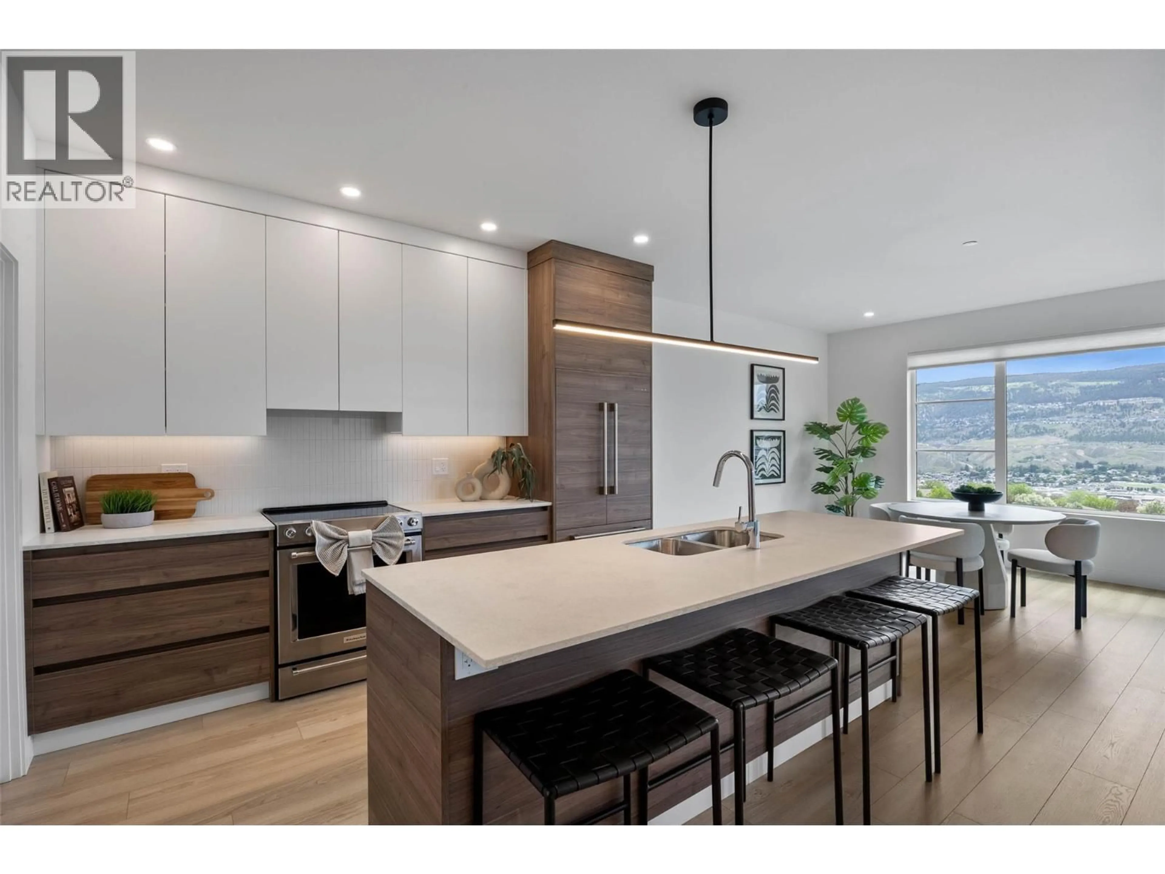 Open concept kitchen, wood/laminate floor for 5046 SUN RIVERS DRIVE, Kamloops British Columbia V2H0E7