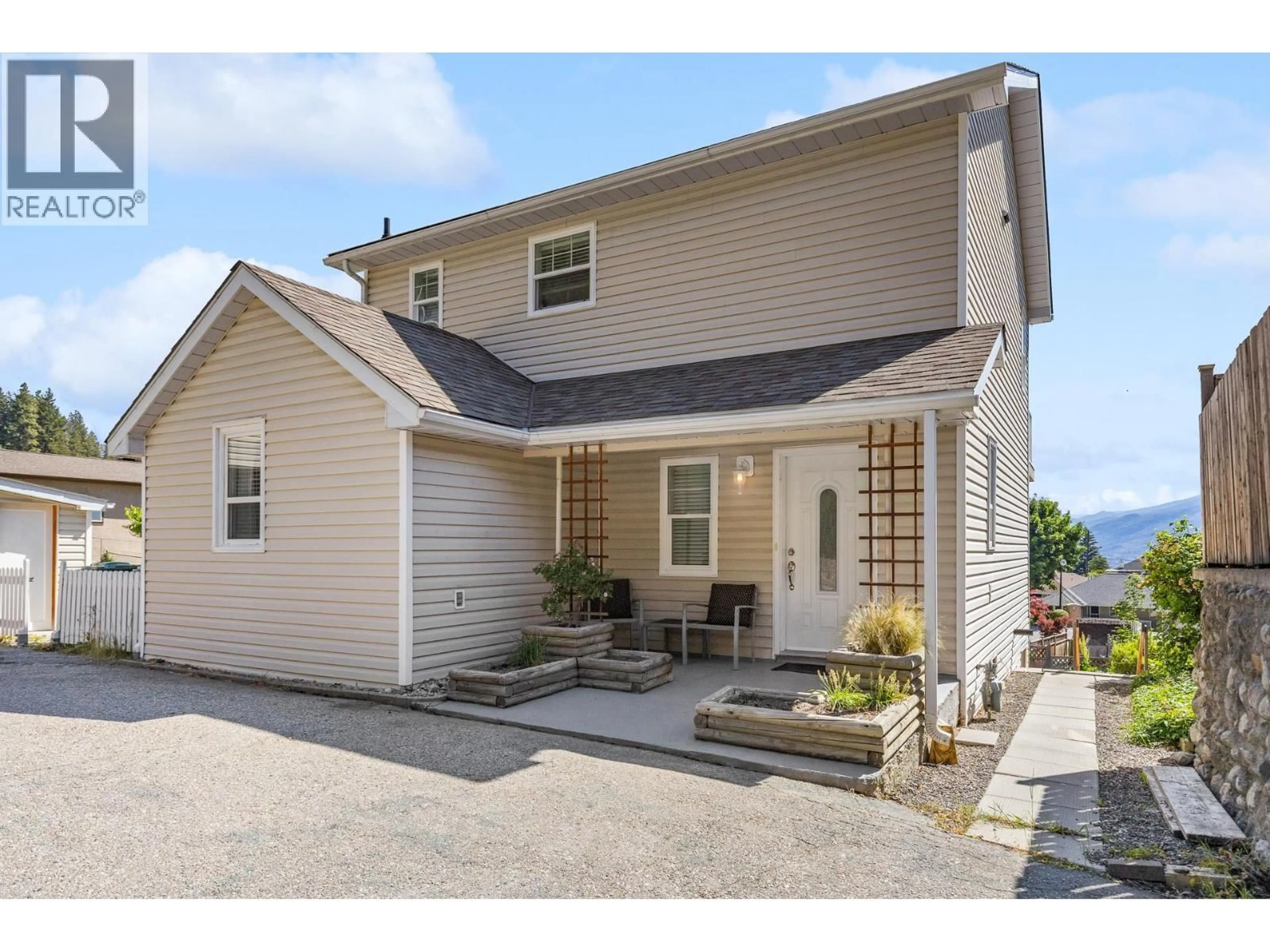 Home with vinyl exterior material, street for 6053 TURNER AVENUE, Peachland British Columbia V0H1X4