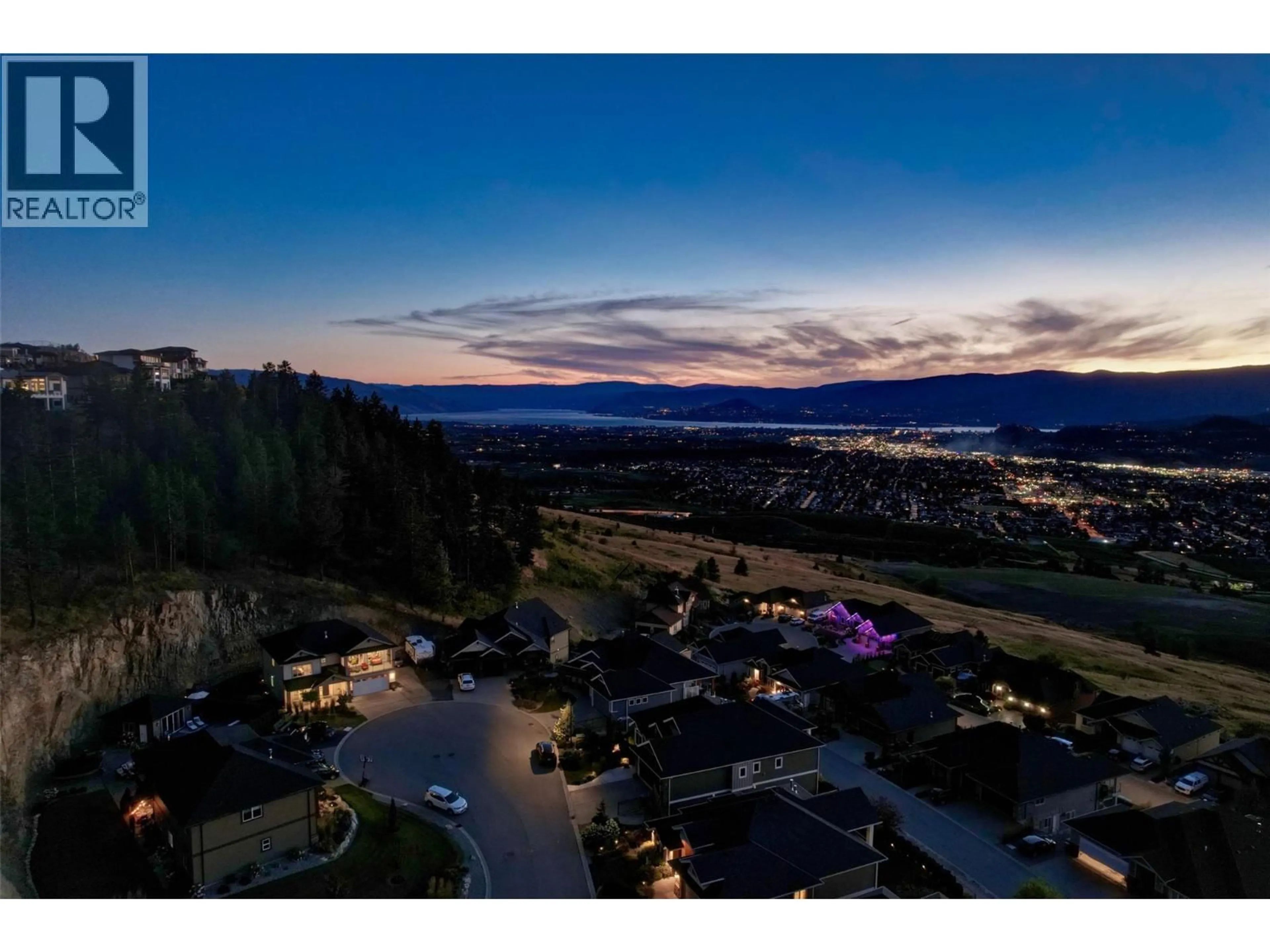 A pic from outside/outdoor area/front of a property/back of a property/a pic from drone, mountain view for 411 PRESTWICK STREET, Kelowna British Columbia V1P1T1