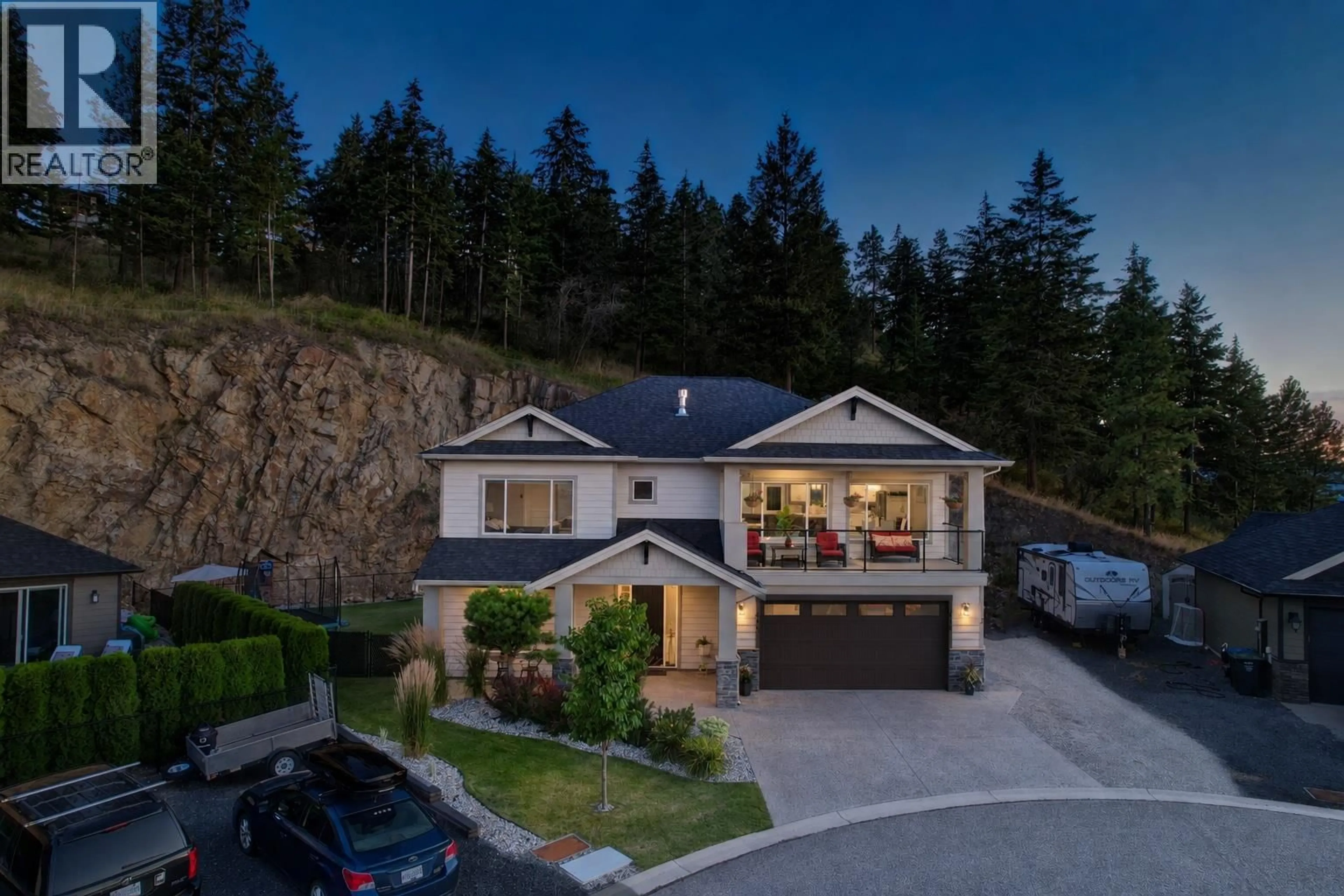 A pic from outside/outdoor area/front of a property/back of a property/a pic from drone, mountain view for 411 PRESTWICK STREET, Kelowna British Columbia V1P1T1