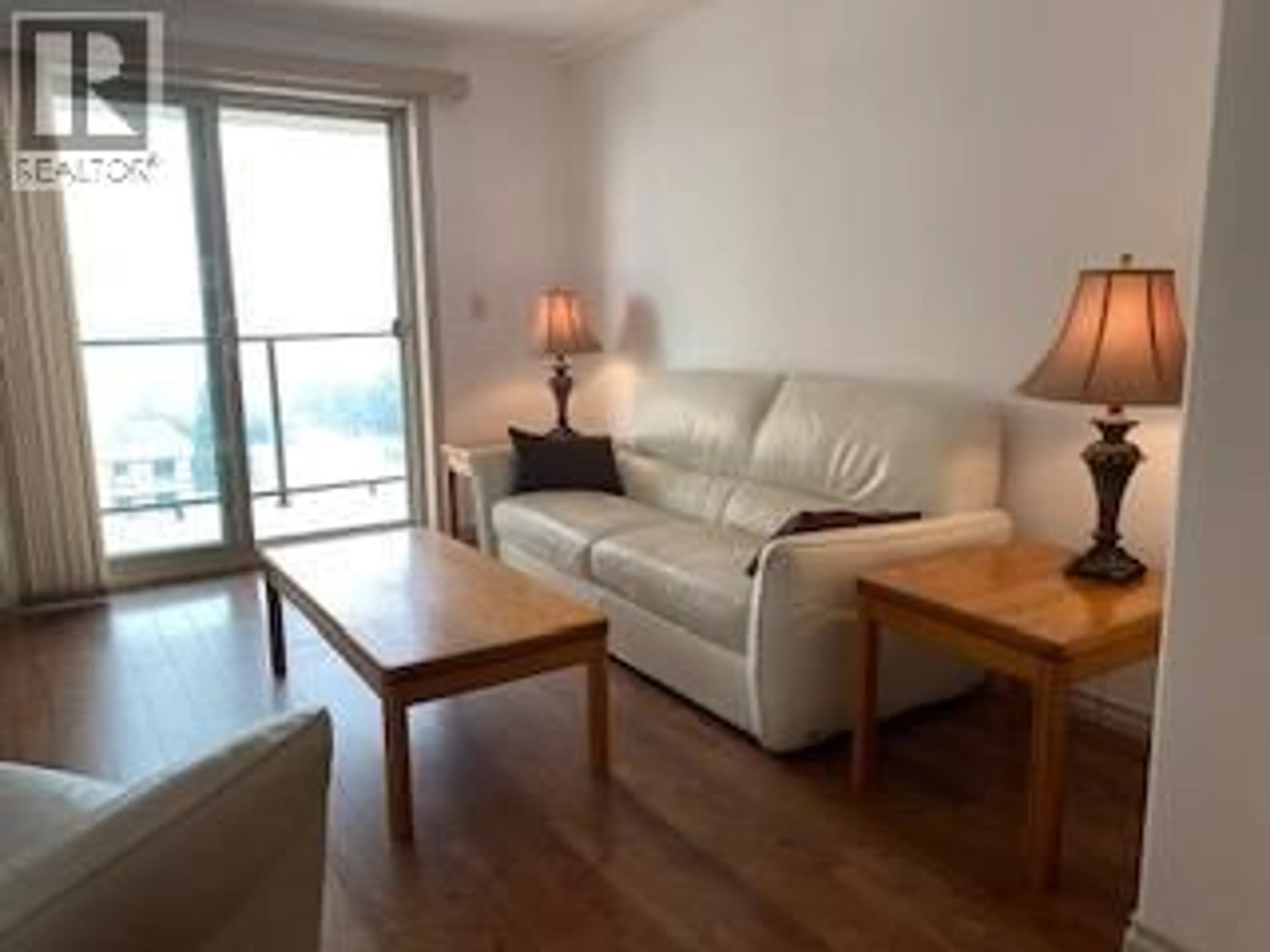 Living room with furniture, wood/laminate floor for 804 - 2125 ATKINSON STREET, Penticton British Columbia V2A9E6