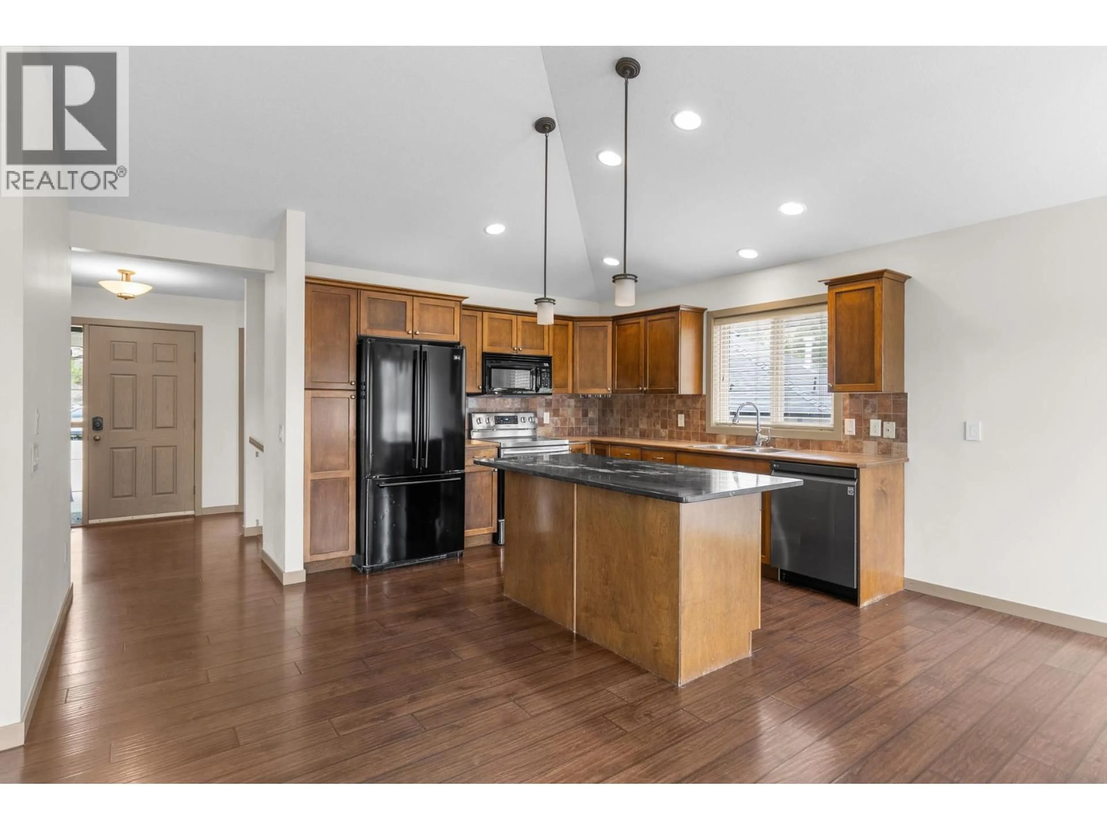 Open concept kitchen, wood/laminate floor for 1939 ROSEALEE LANE, West Kelowna British Columbia V1Z4A8