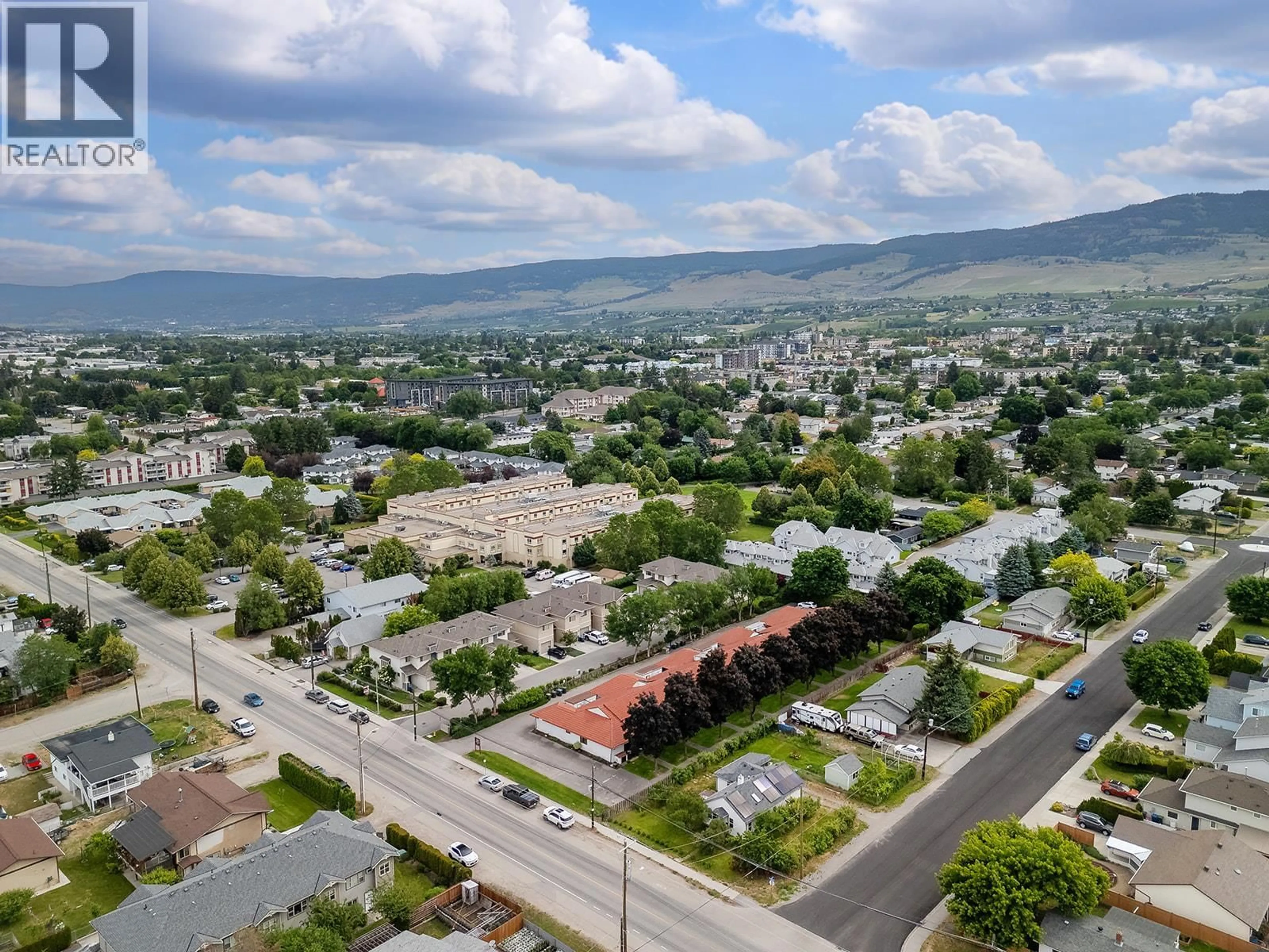 A pic from outside/outdoor area/front of a property/back of a property/a pic from drone, mountain view for 6 - 363 GERSTMAR ROAD, Kelowna British Columbia V1X4A6