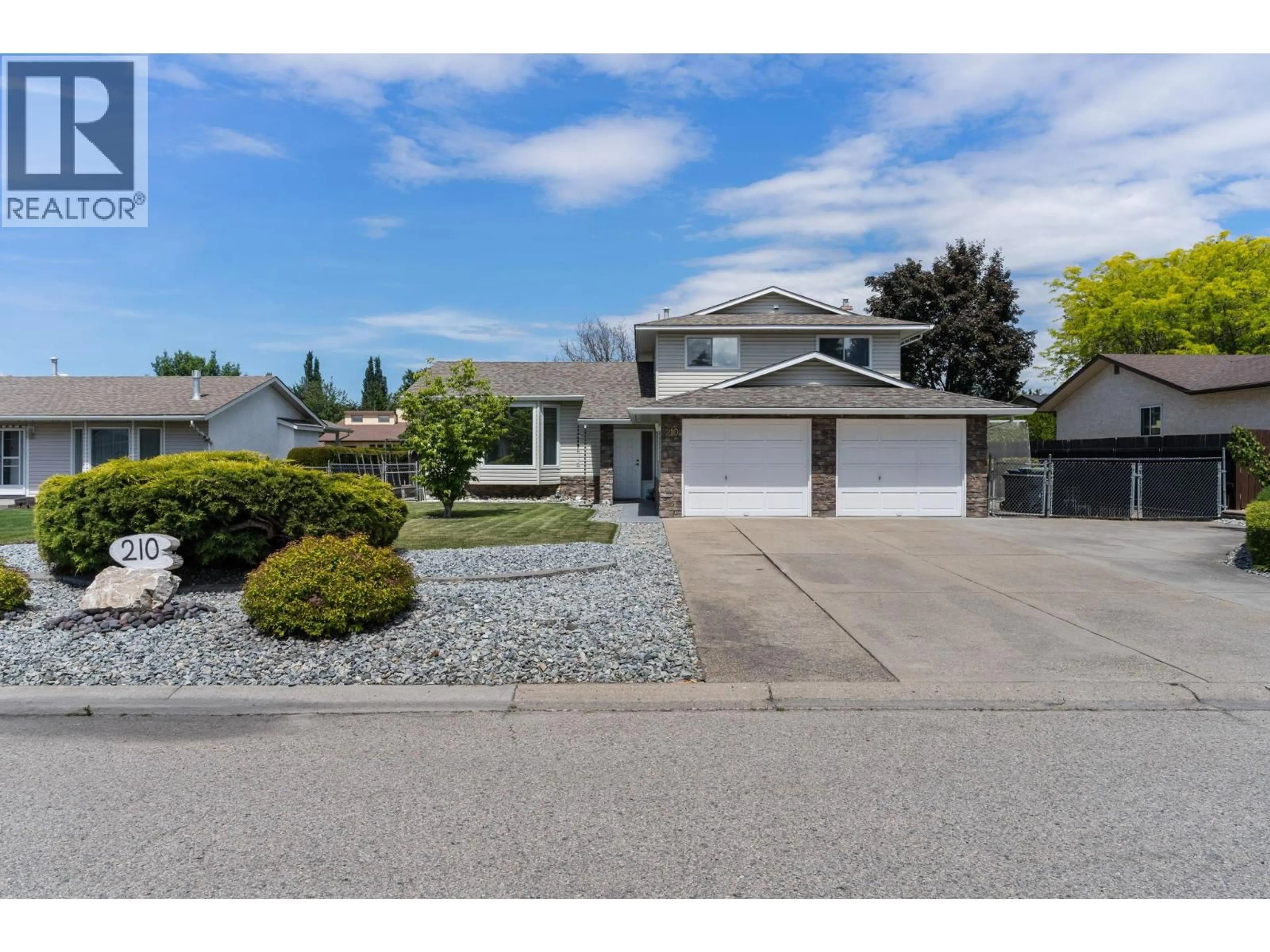 Home with vinyl exterior material, street for 210 FELIX ROAD, Kelowna British Columbia V1X7C9